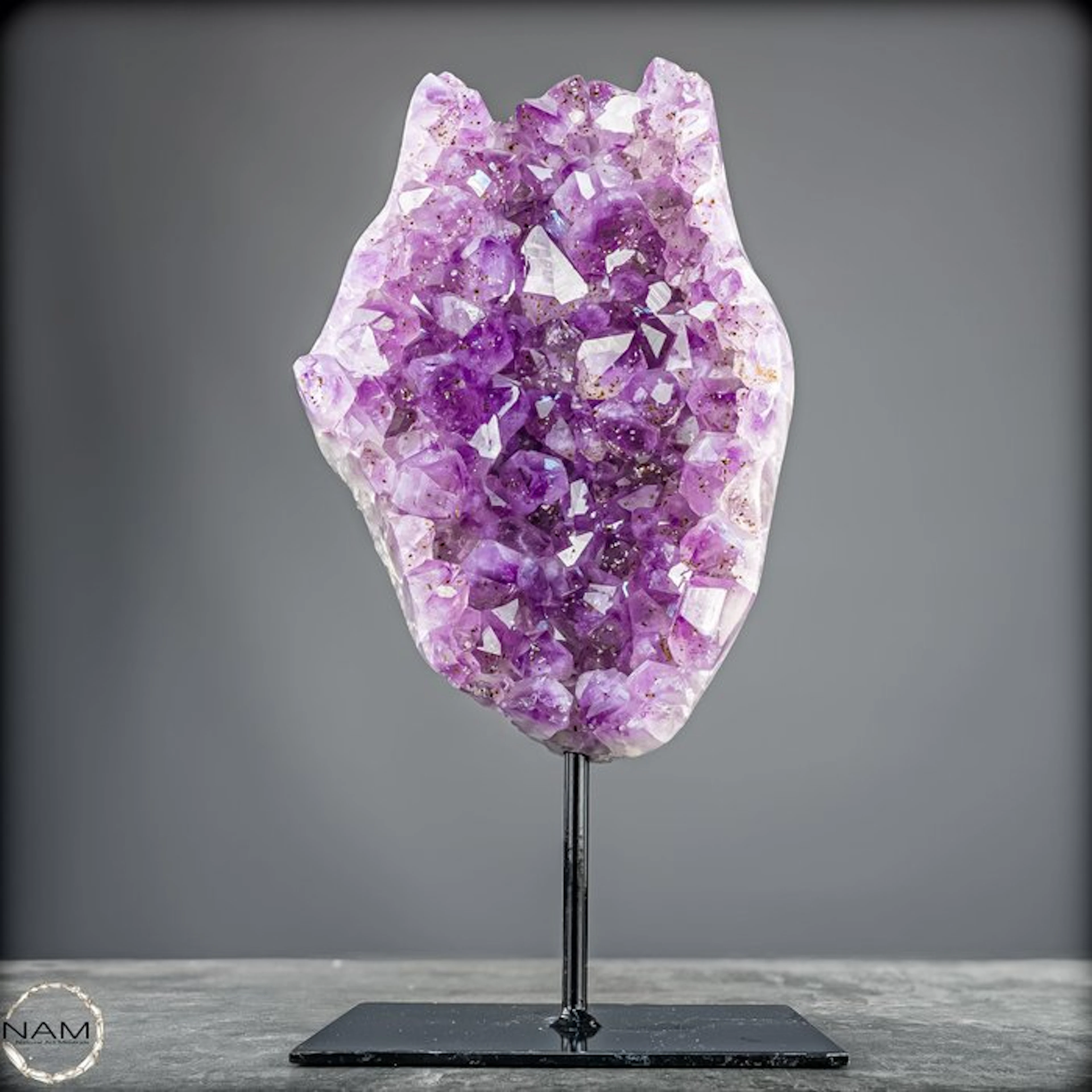 Stunning amethyst on a stand — majestic crystal energy in an elegant display