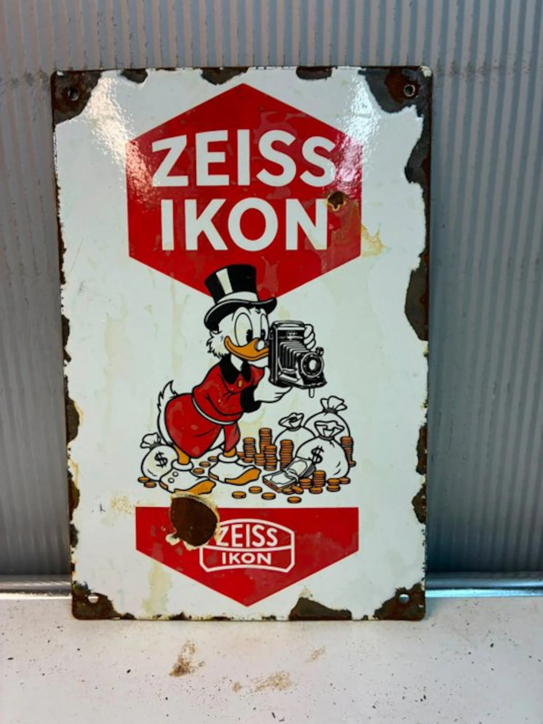 Zeiss Ikon – billboard featuring Scrooge McDuck and a...