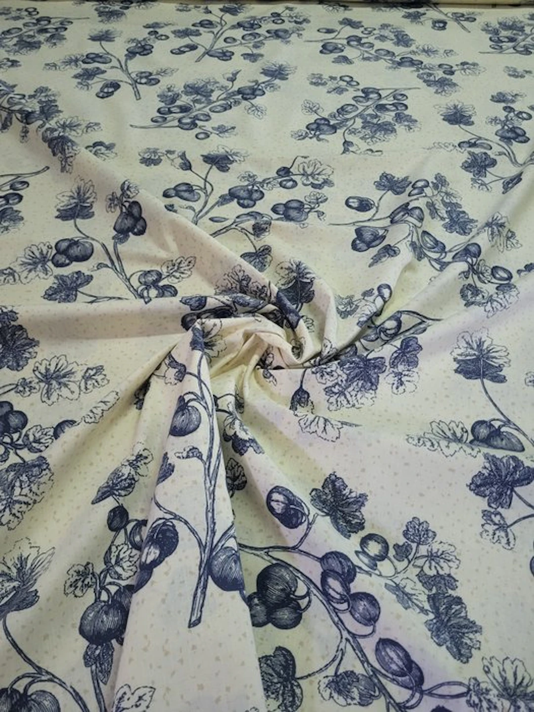 Wonderful fabric with blue sprigs on a light beige background