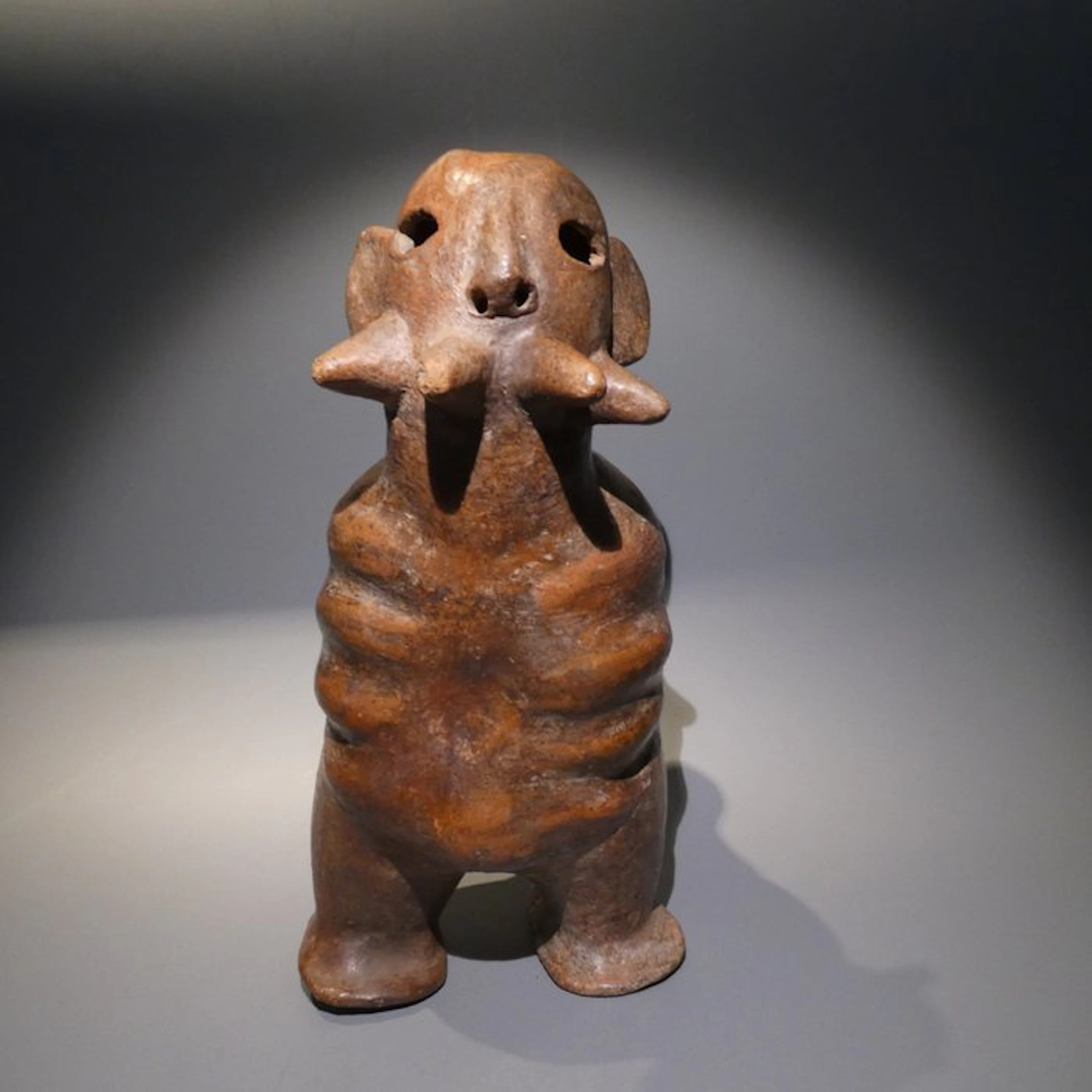 Vicus, Peru Terracotta Figurative vessel with handle
