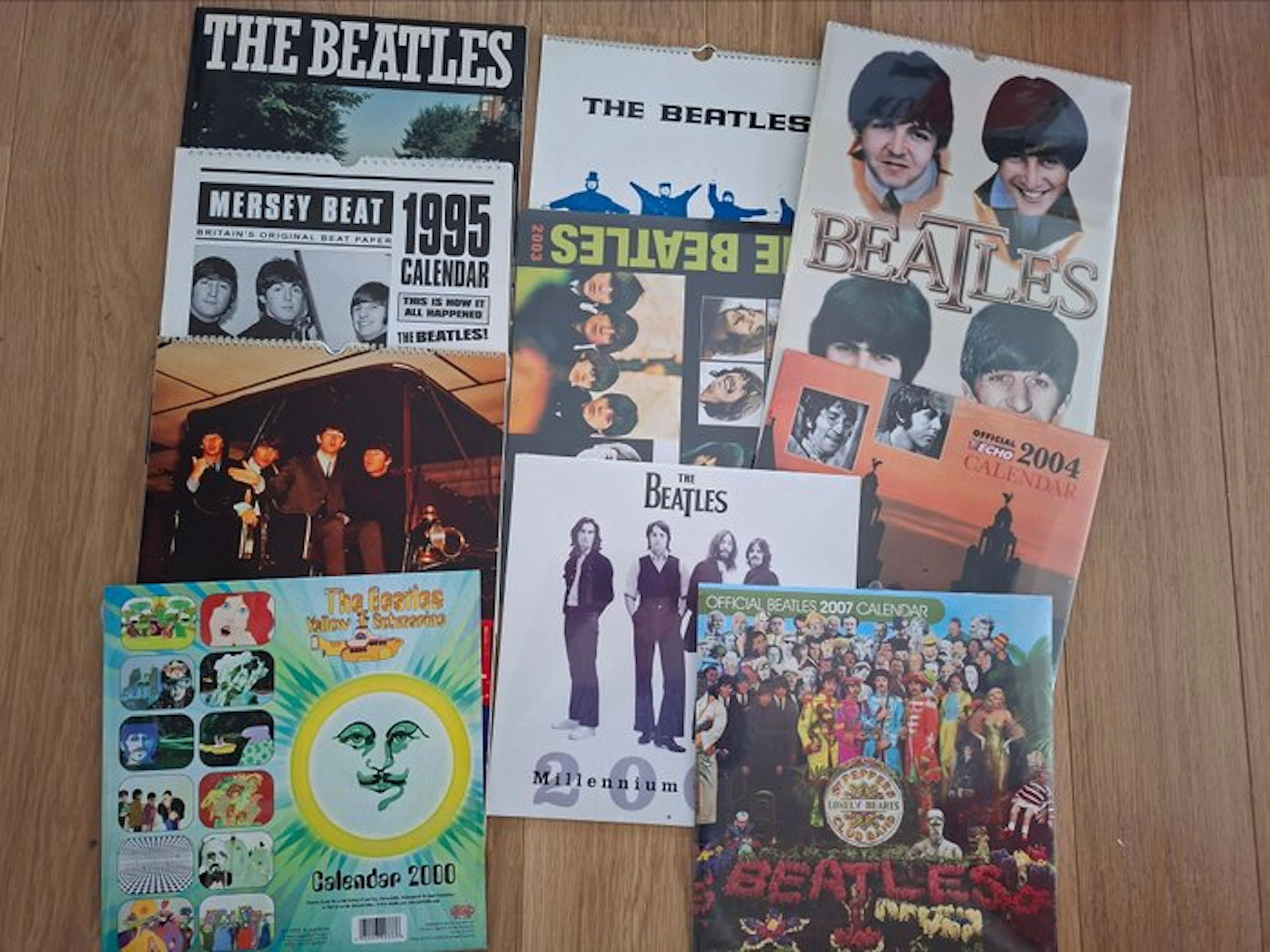 Beatles - Lot of 24 The Beatles Calendars (18 Sealed) + Poster Book