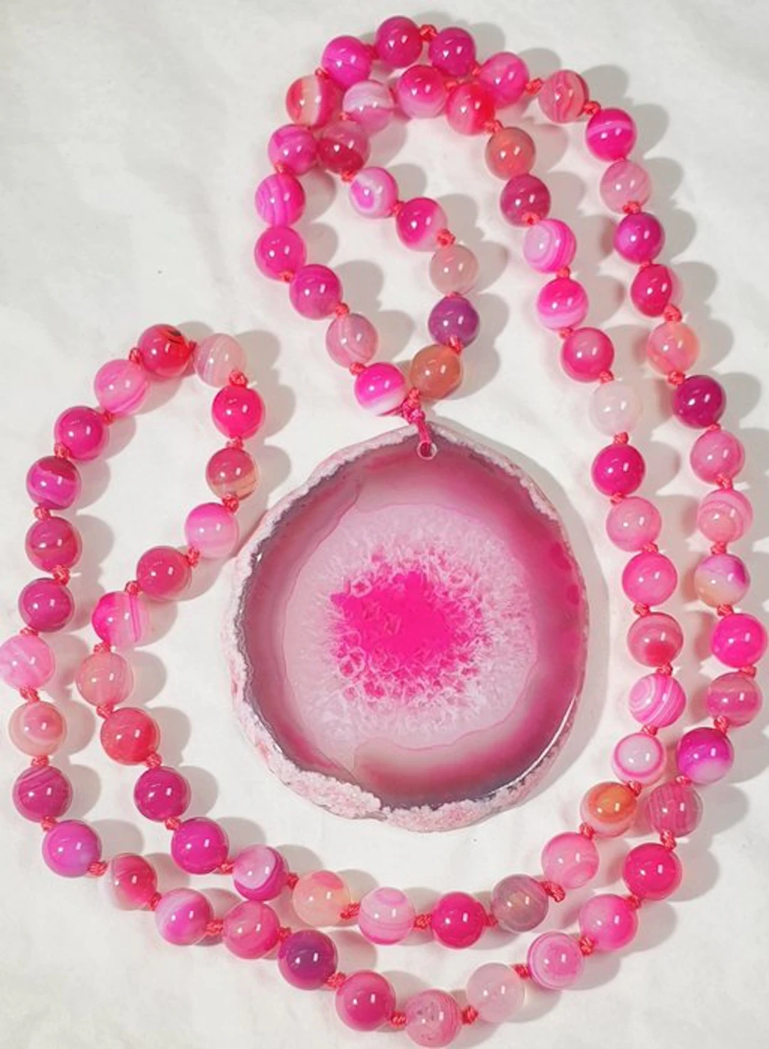 Banded Agate Slice and Pink-Colored Agates - Saint Agatha...