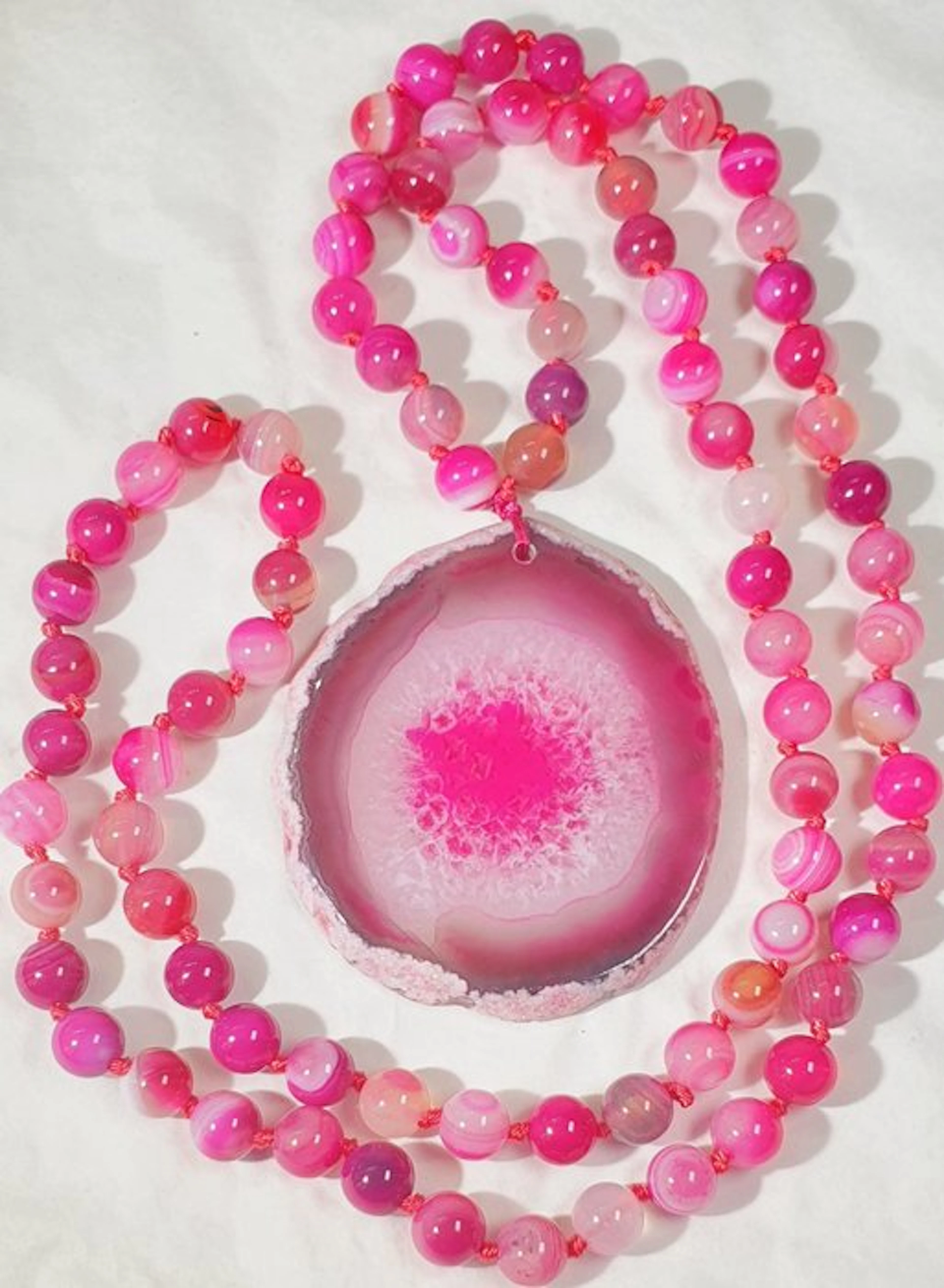 Banded Agate Slice and Pink-Colored Agates - Saint Agatha...