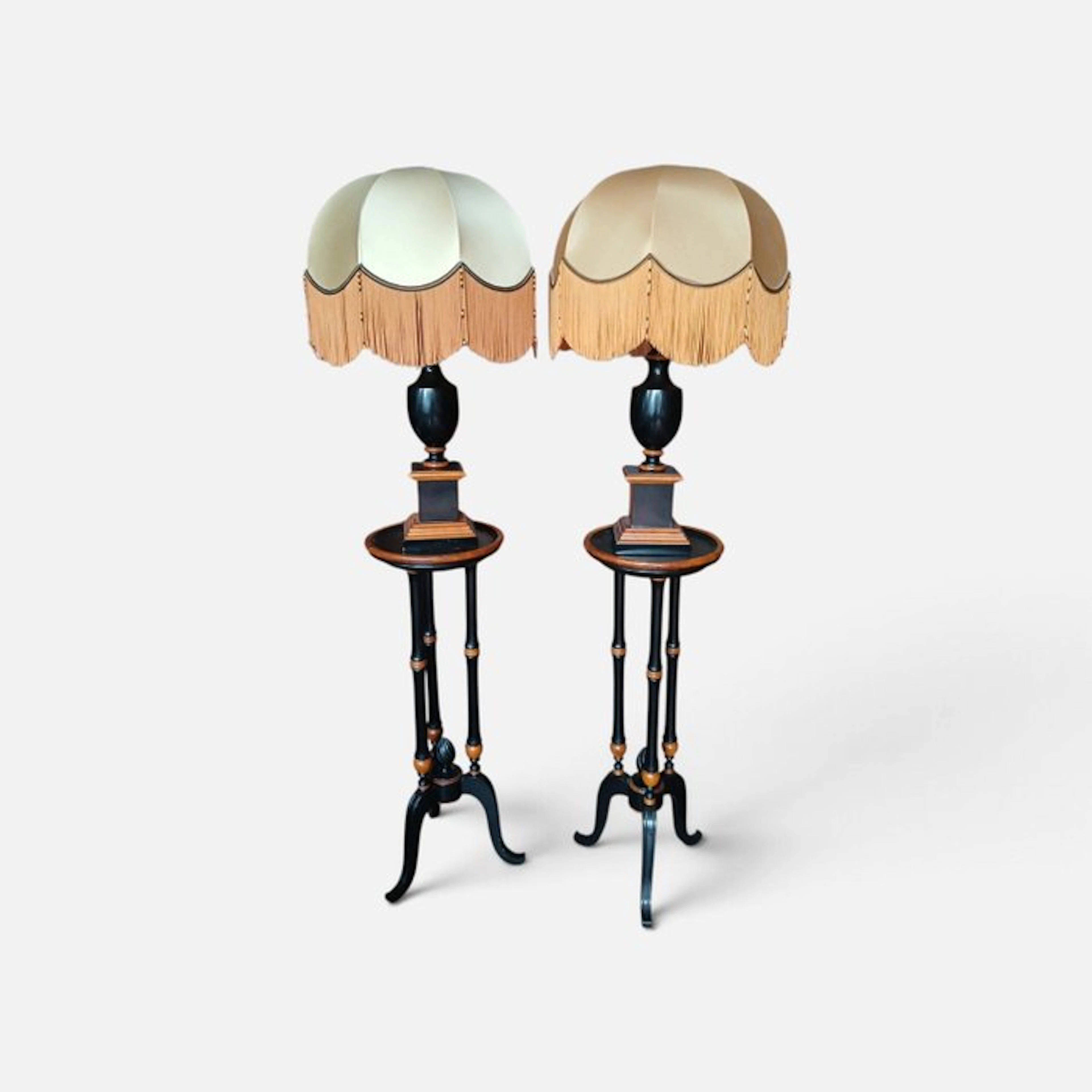 Pair of ebonized pillar black lacquered urn lamps...