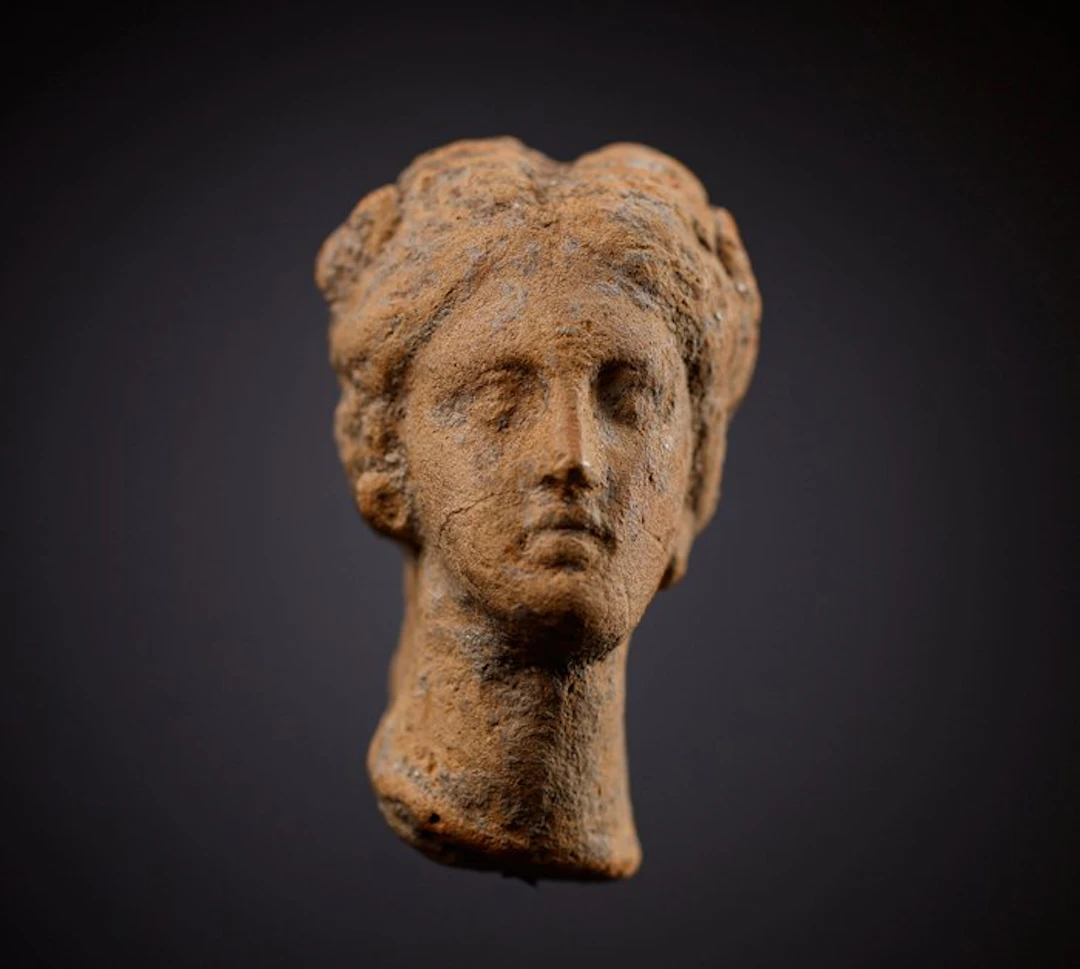 Ancient Greece, terracotta female head - 4.5 cm