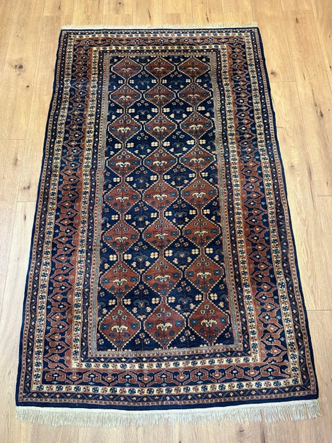 Exclusive hand-knotted Buchara Jomud rug with a traditional diamond pattern