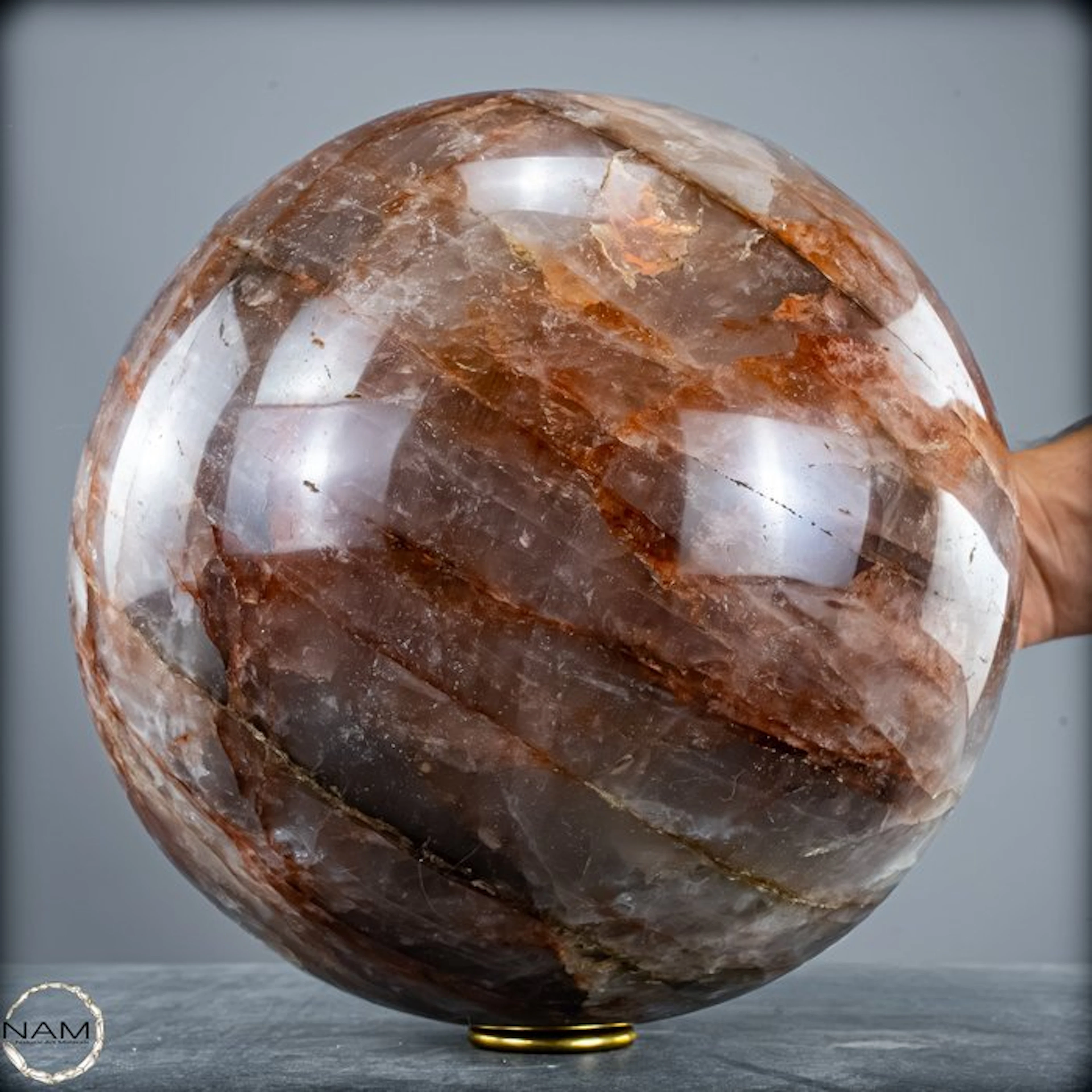 Breathtaking fire quartz sphere – fascinating red mineral veins