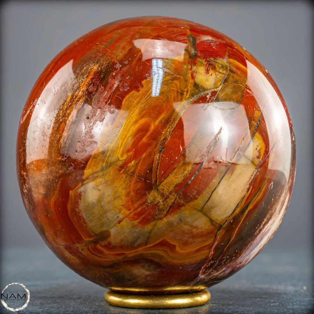 Natural petrified wood as a sphere – intense grain with...