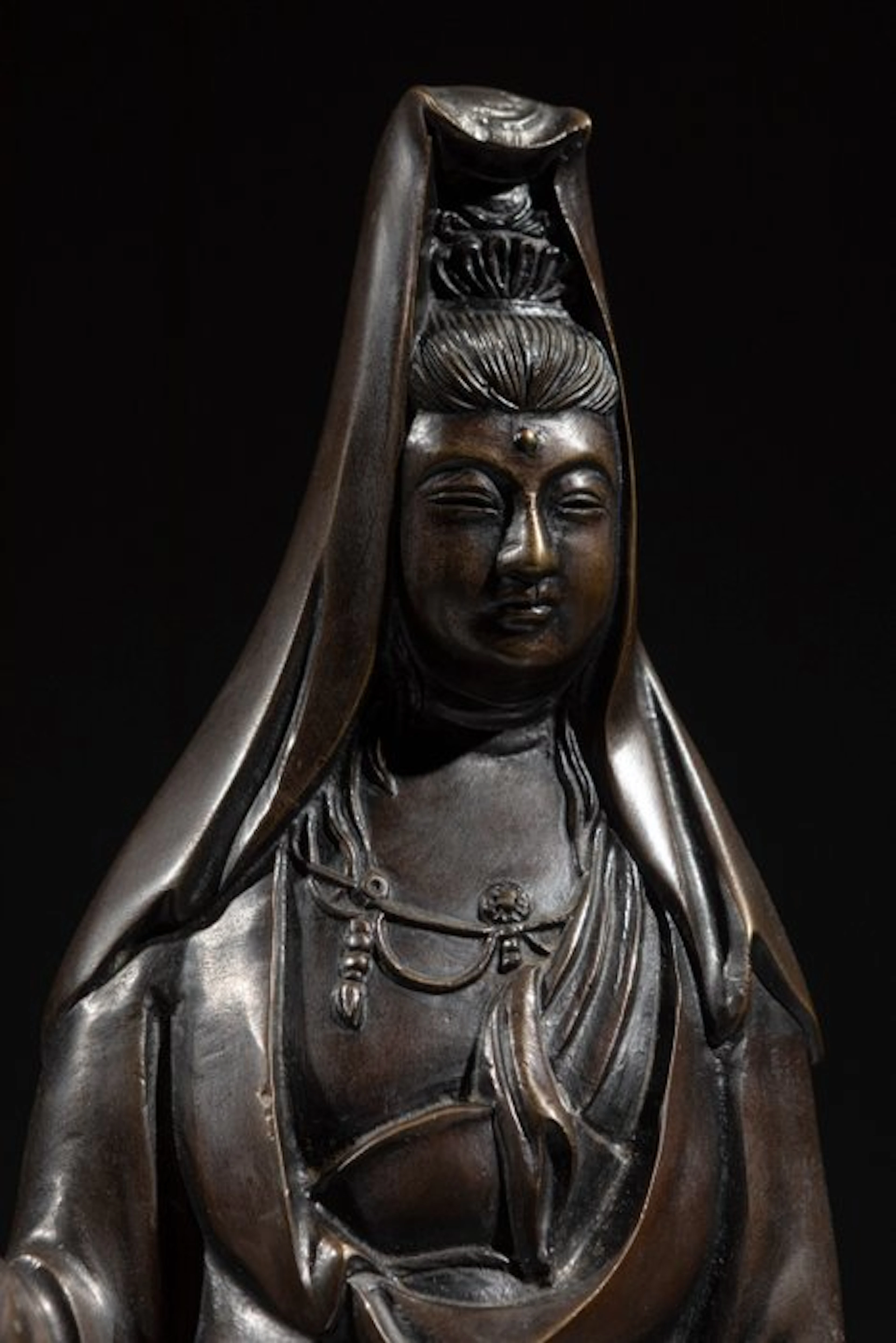 Bronze - A large bronze okimono of Kannon standing with...
