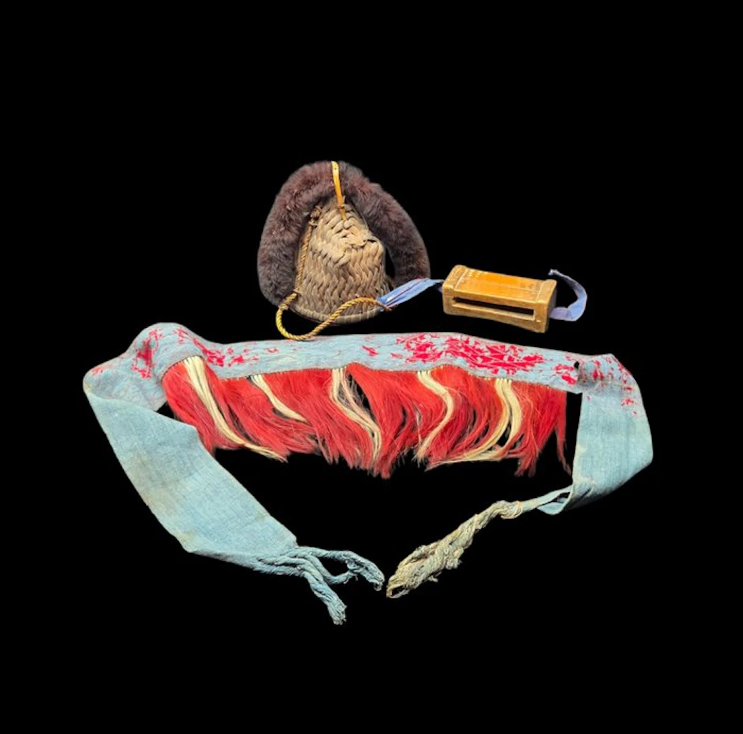 Naga costume – an antique headdress – a carved wooden...