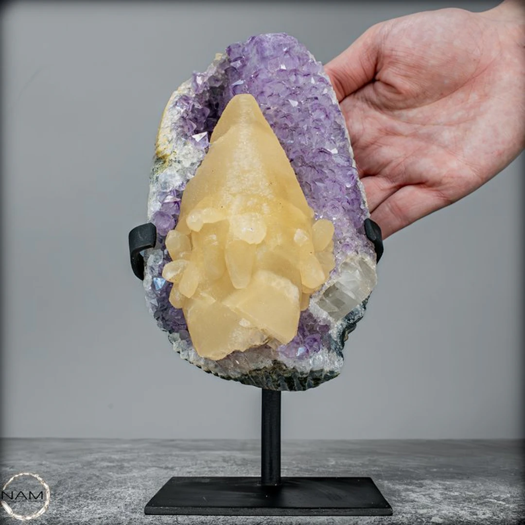 Natural amethyst druse with perfect calcite crystal