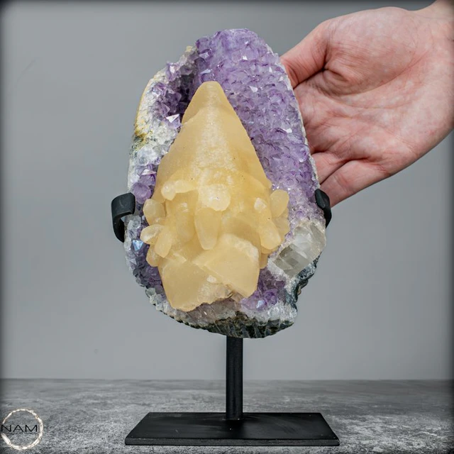 Natural amethyst druse with perfect calcite crystal