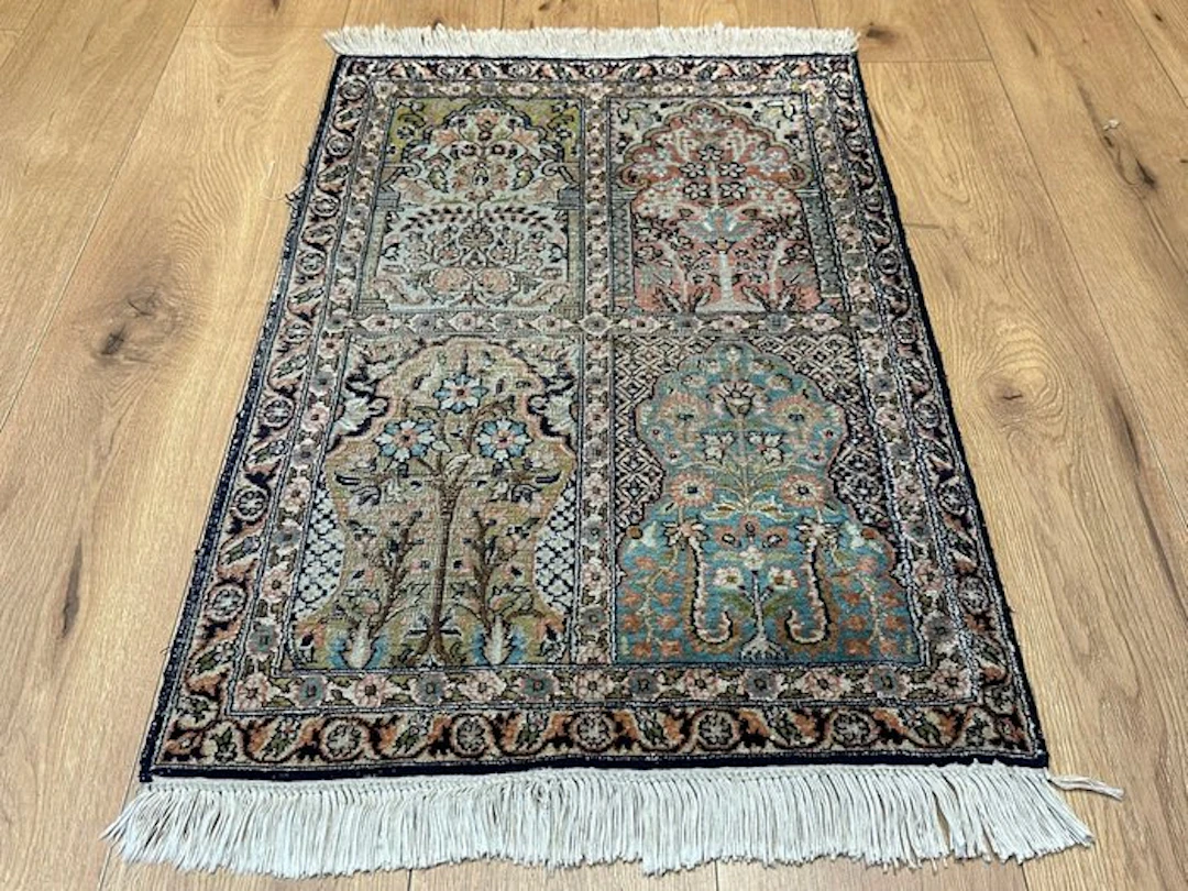 Exquisite Kashmiri silk rug with a delicate four-field...