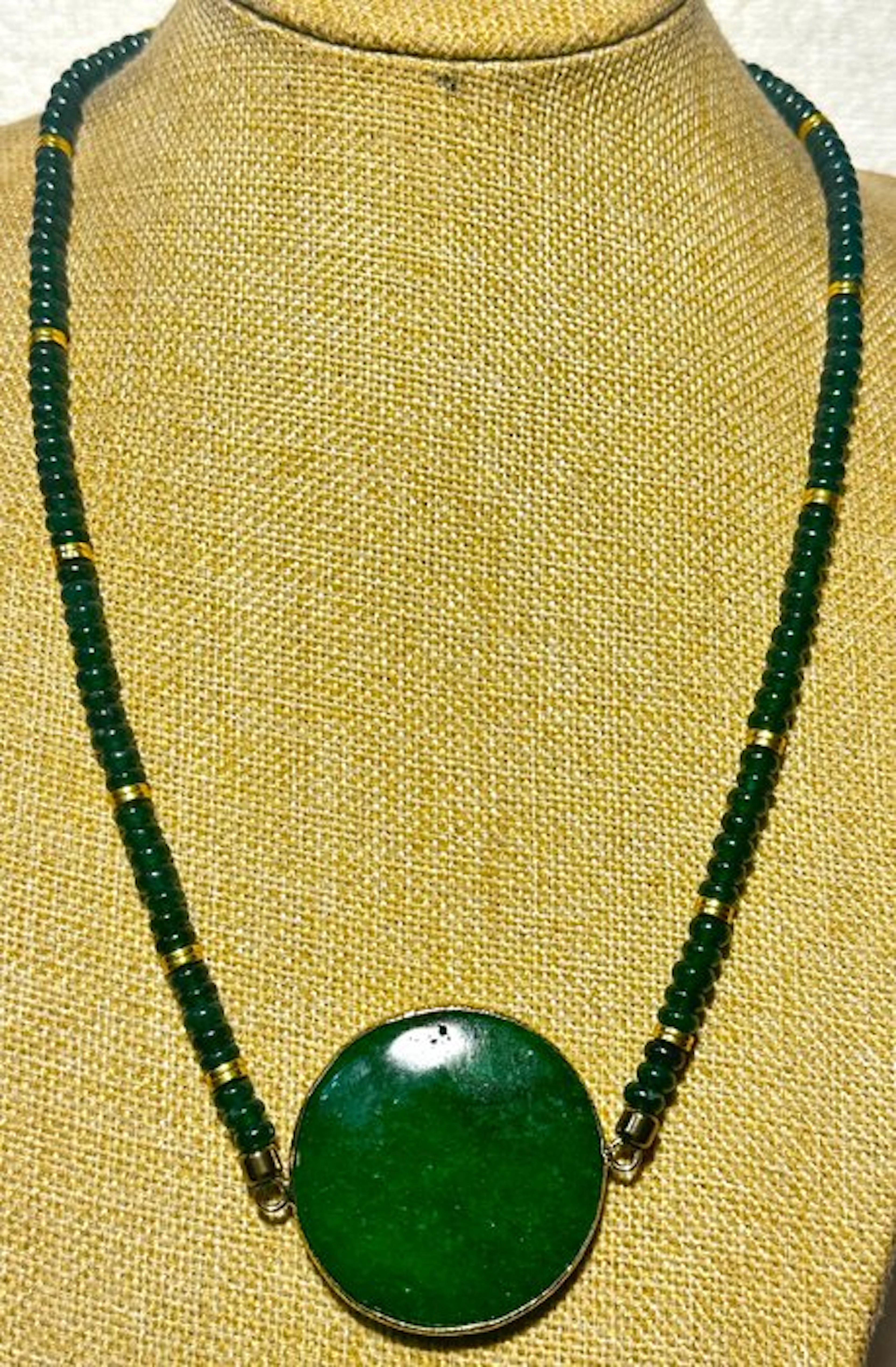 Exclusive necklace of natural green jade and golden hematite
