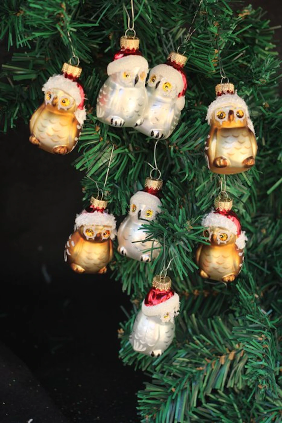 Krebs: miniatuur uiltjes met kerstmuts