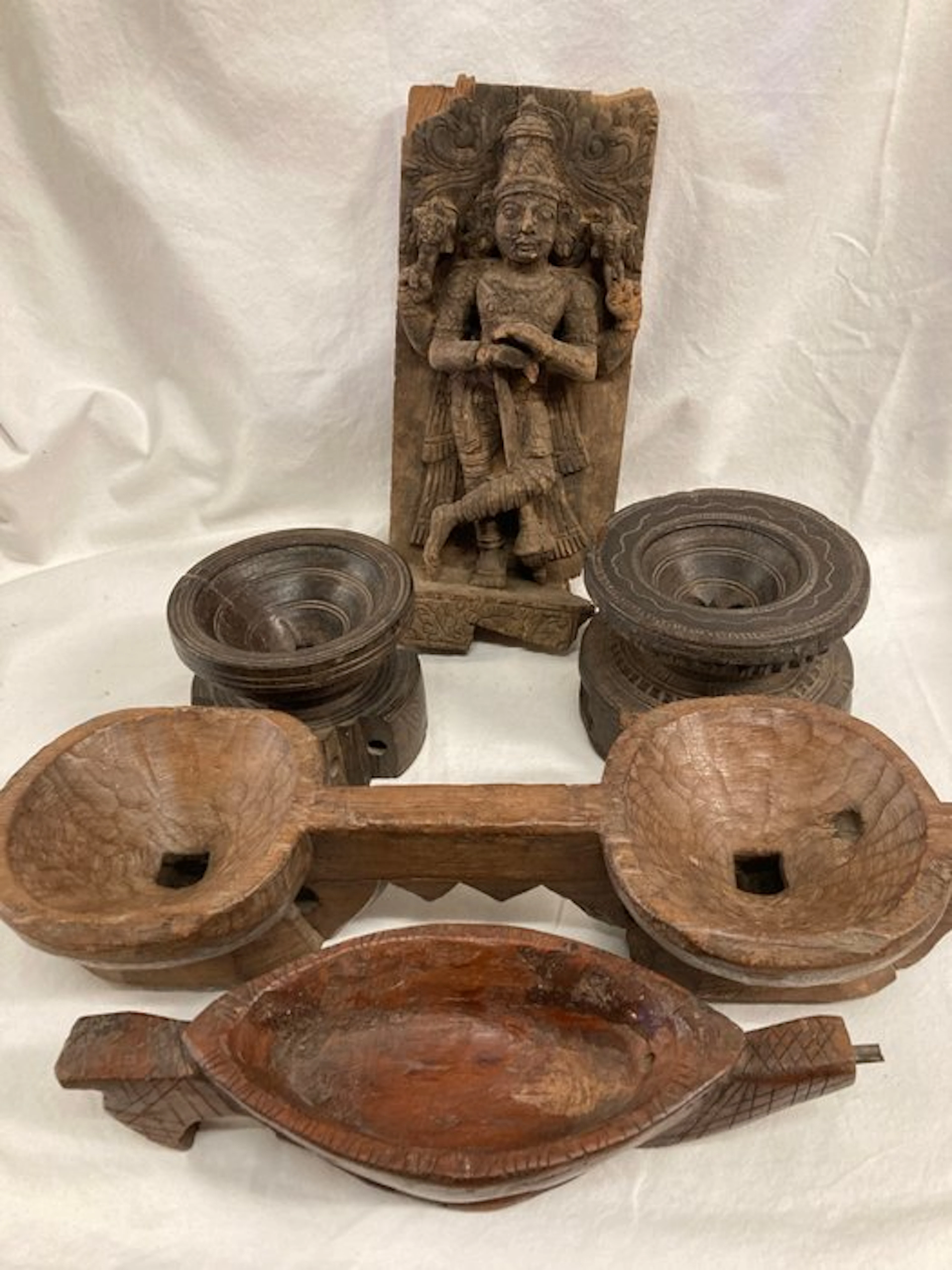 Wooden relief of Shiva and a collection of peasant utensils