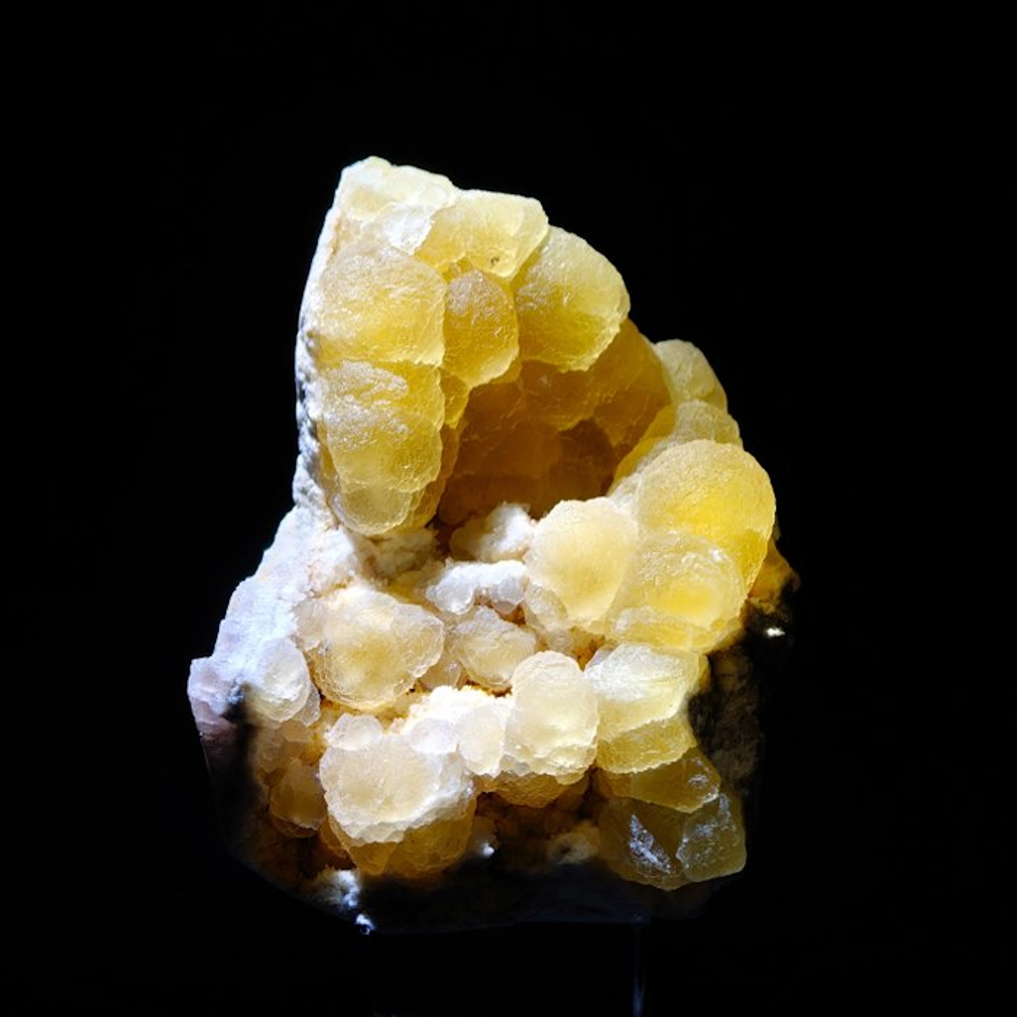 Yellow spherical fluorite on quartz