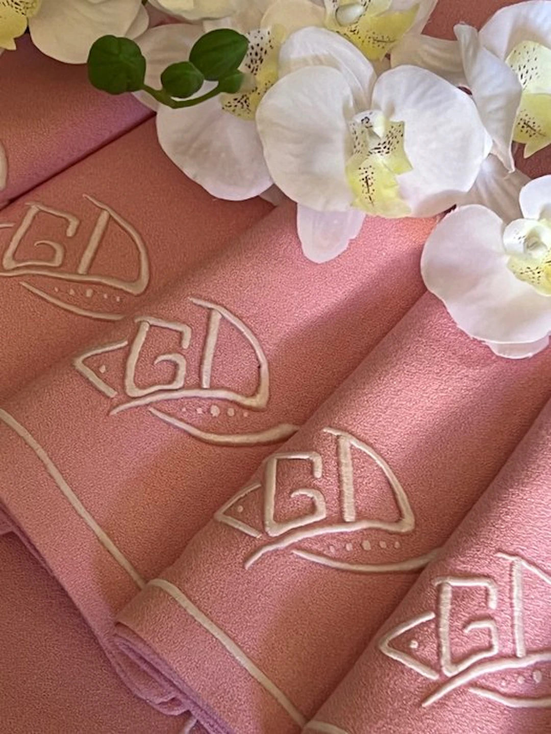Two tablecloths with eight matching napkins