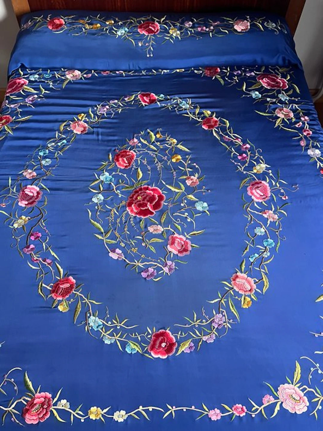 ** Antique embroidered silk bedspread with a large floral center for large beds