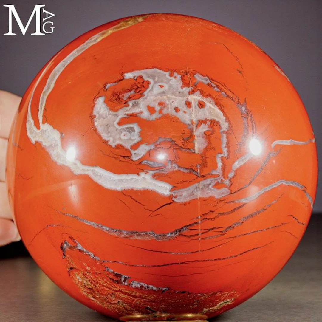 Vibrant Red Jasper Sphere with Intricate White Veins...