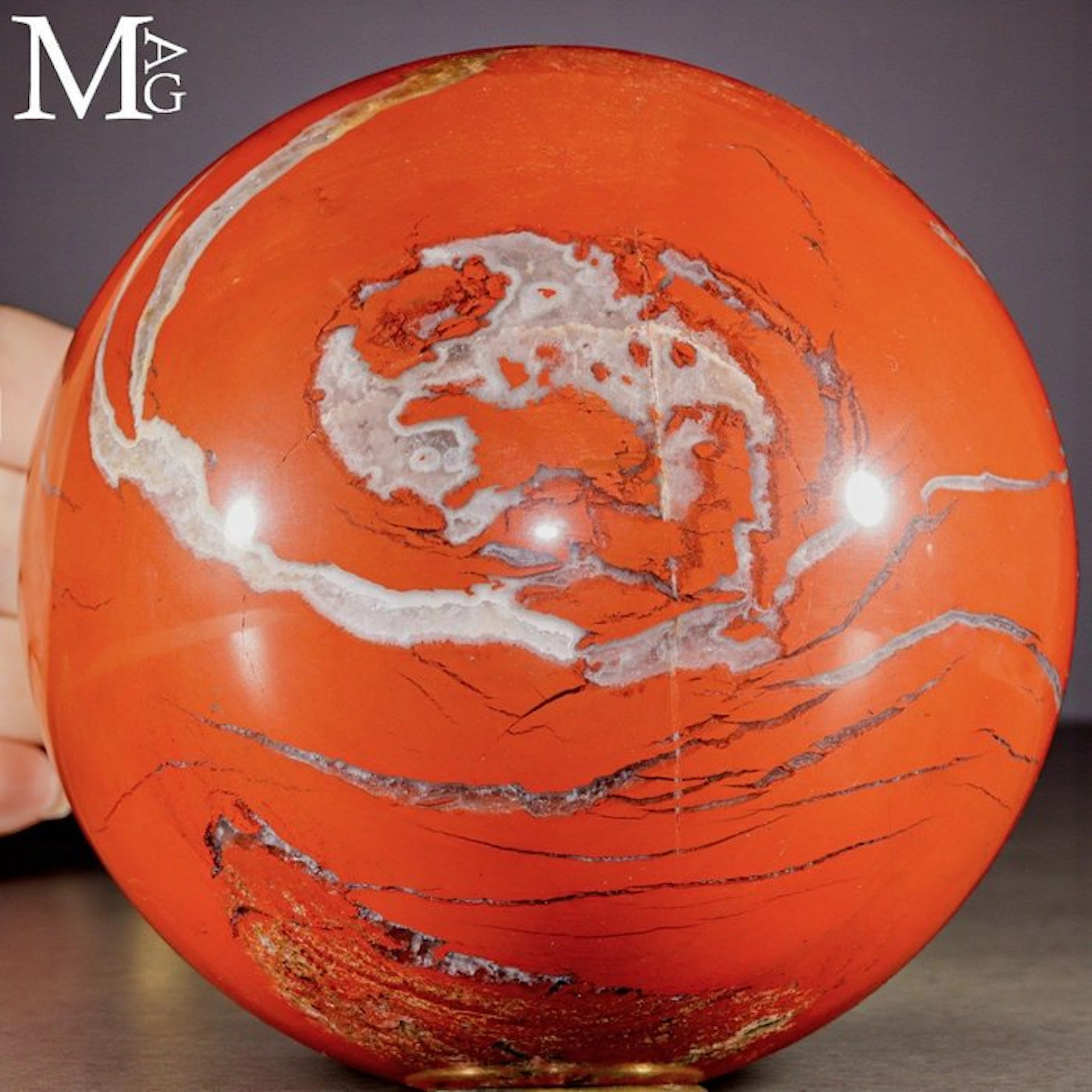 Vibrant Red Jasper Sphere with Intricate White Veins...