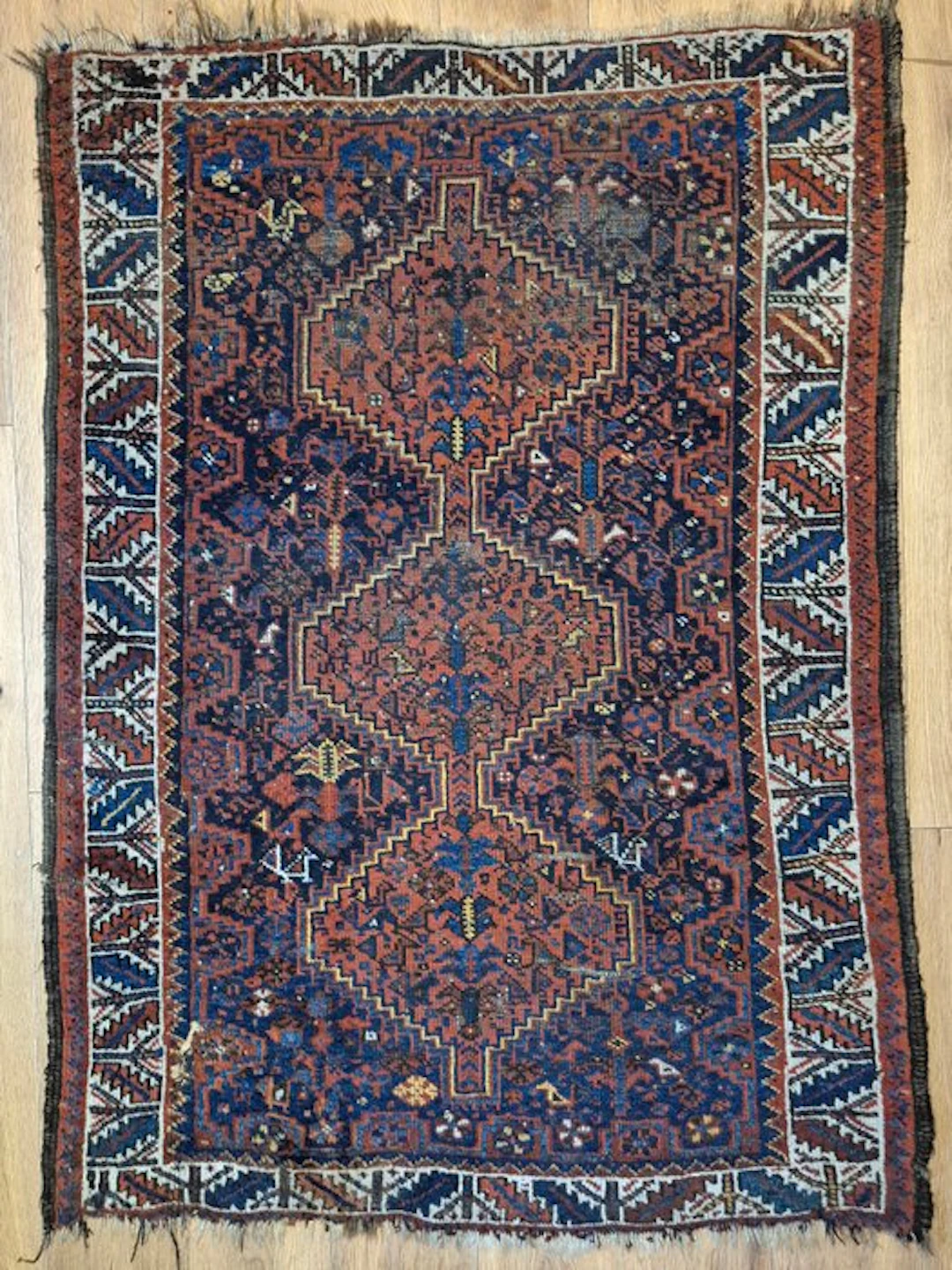 Ancient Caucasian Kazak carpet with a geometric diamond pattern