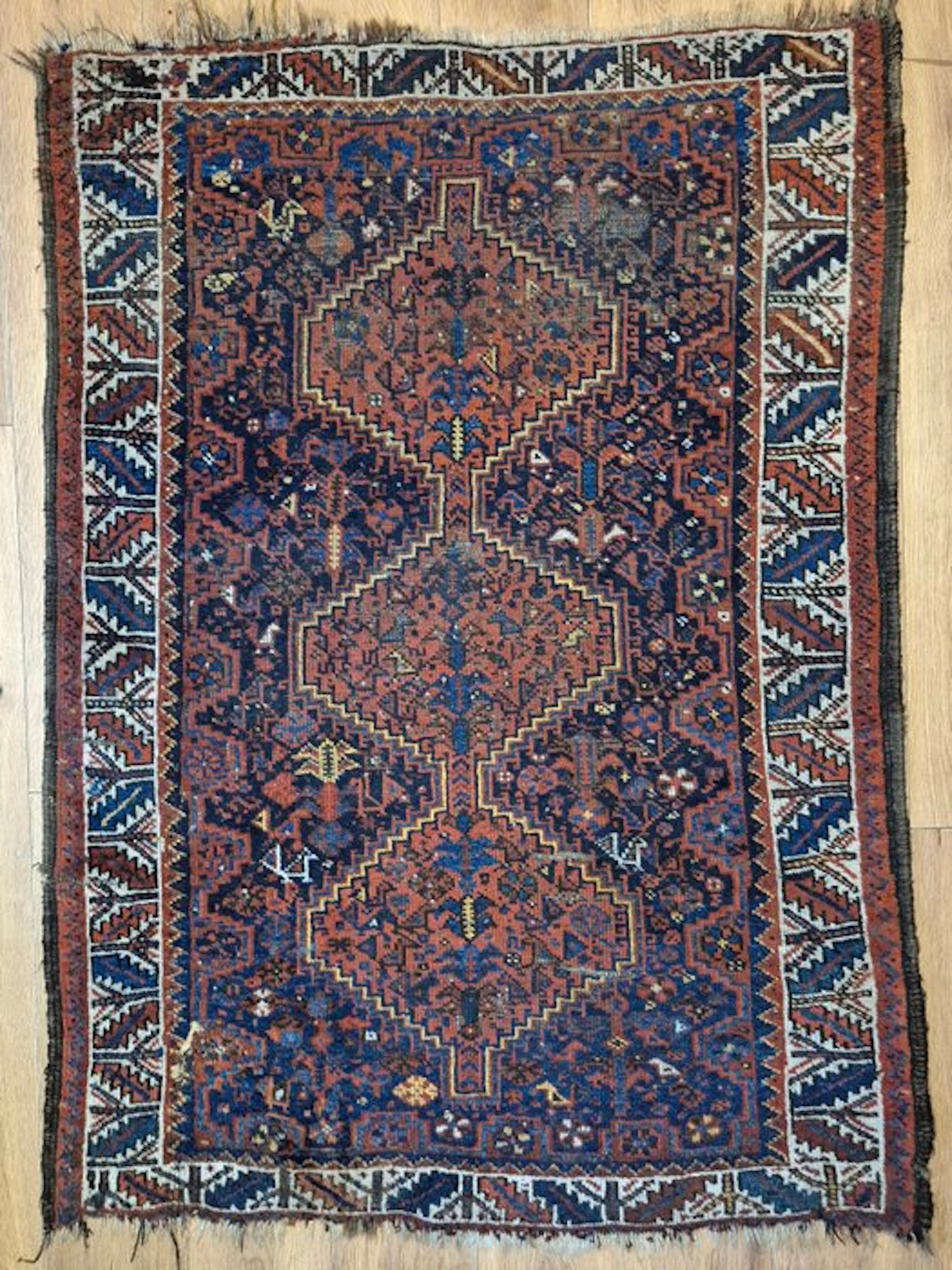 Ancient Caucasian Kazak carpet with a geometric diamond pattern