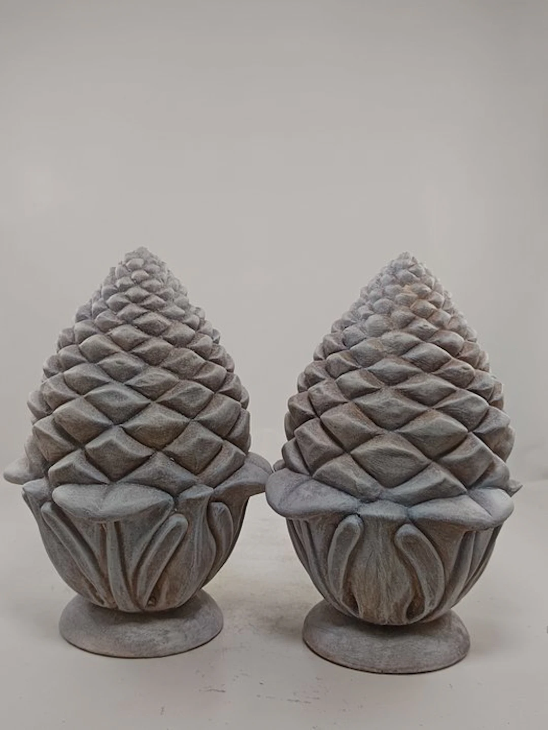 Figure - Pair of Sicilian pine cones made of white patinated terracotta.