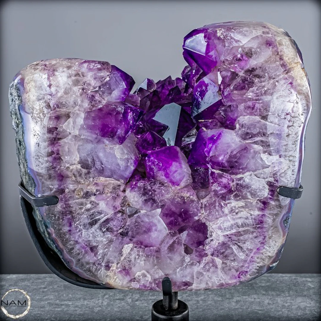 Amethyst druse from Bolivia on a metal stand – deep...