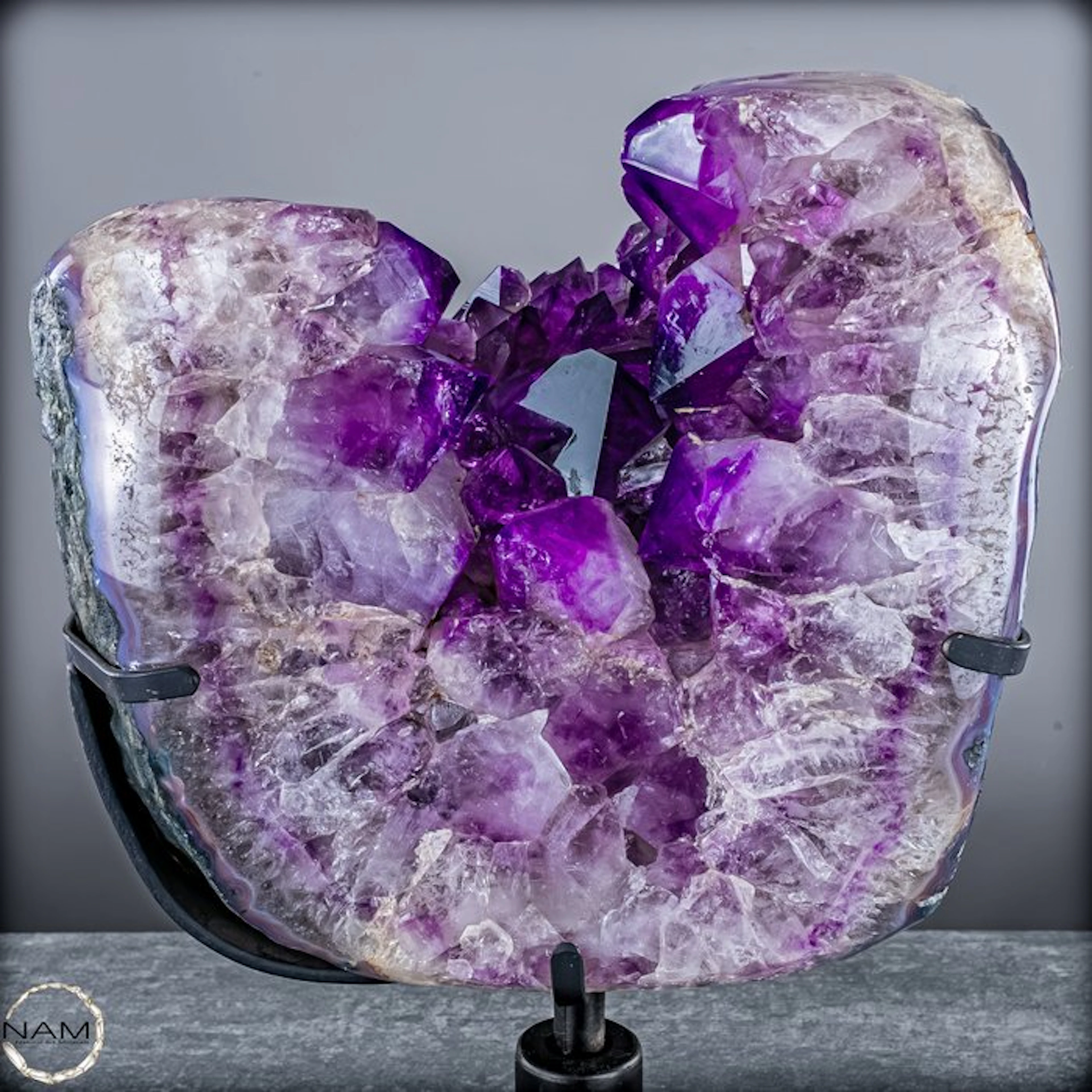 Amethyst druse from Bolivia on a metal stand – deep...