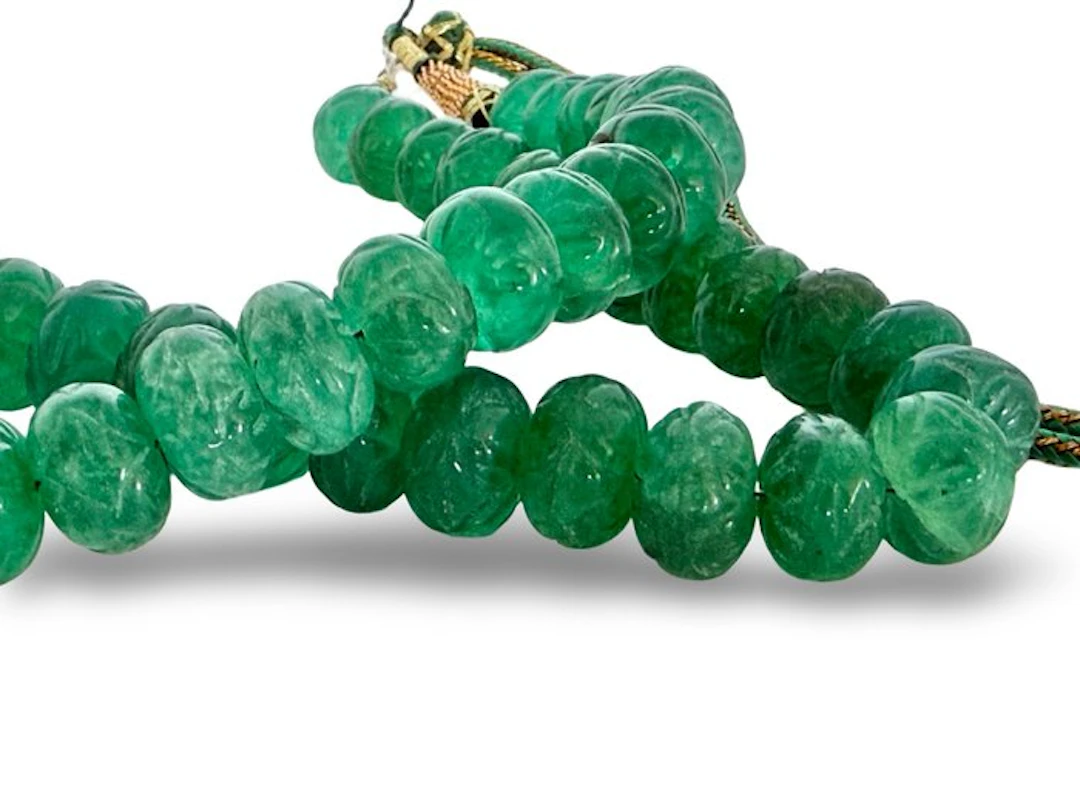 Approximately 46 handmade emerald-colored quartz beads from India.- 160 g
