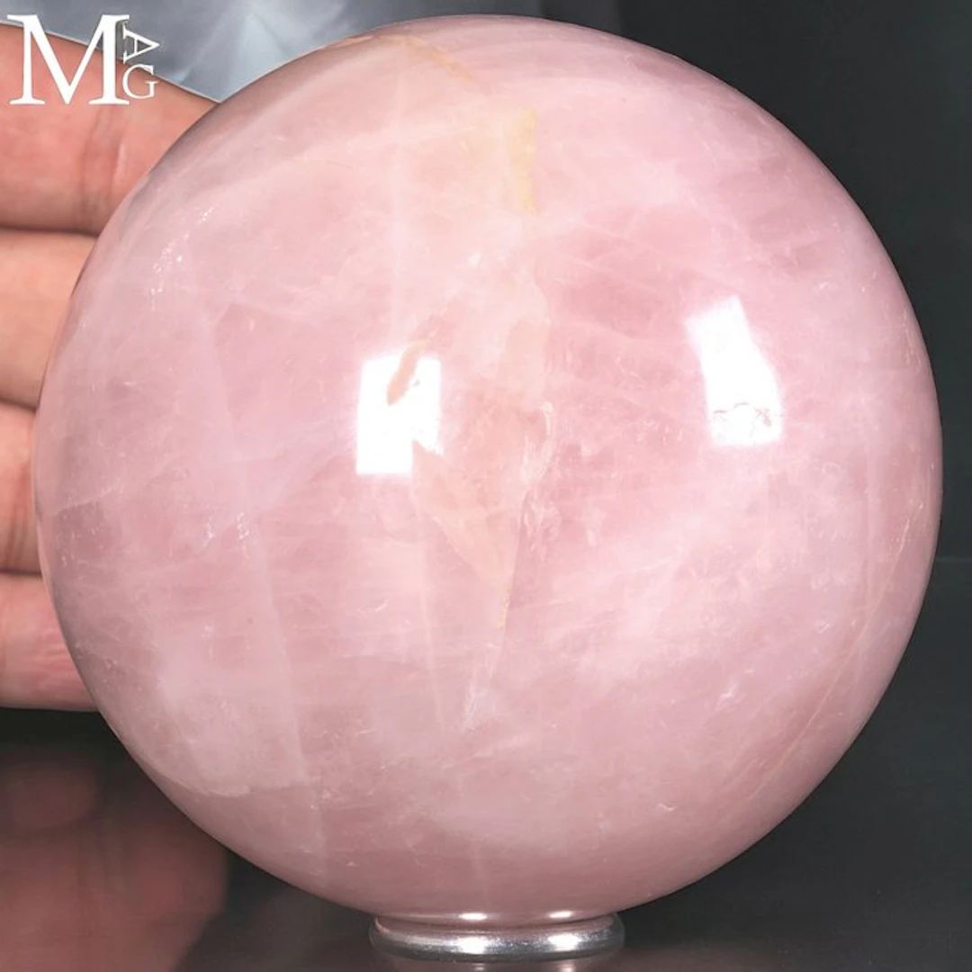 Polished Rose Quartz Sphere with a Delicate Pink Hue...