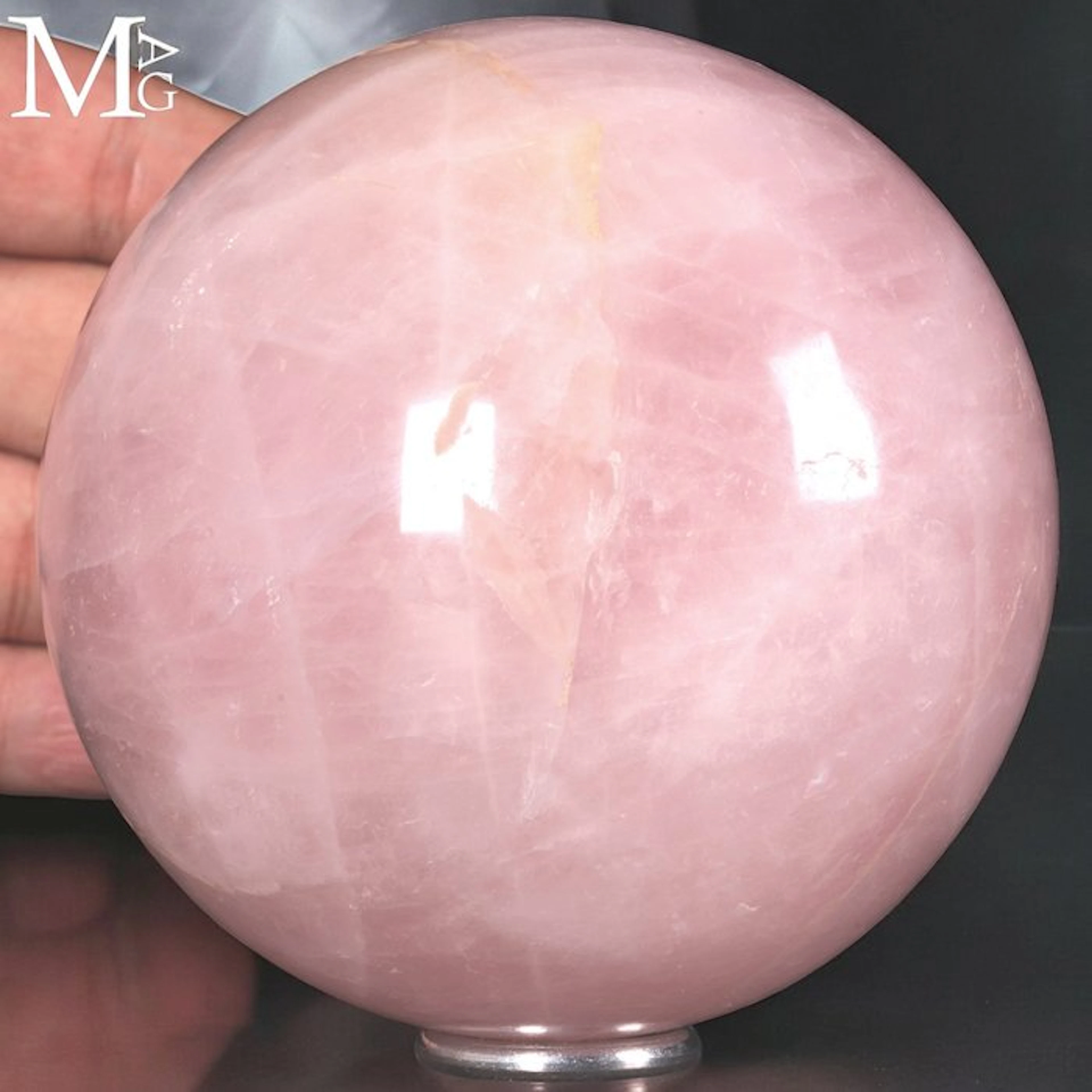 Polished Rose Quartz Sphere with a Delicate Pink Hue...