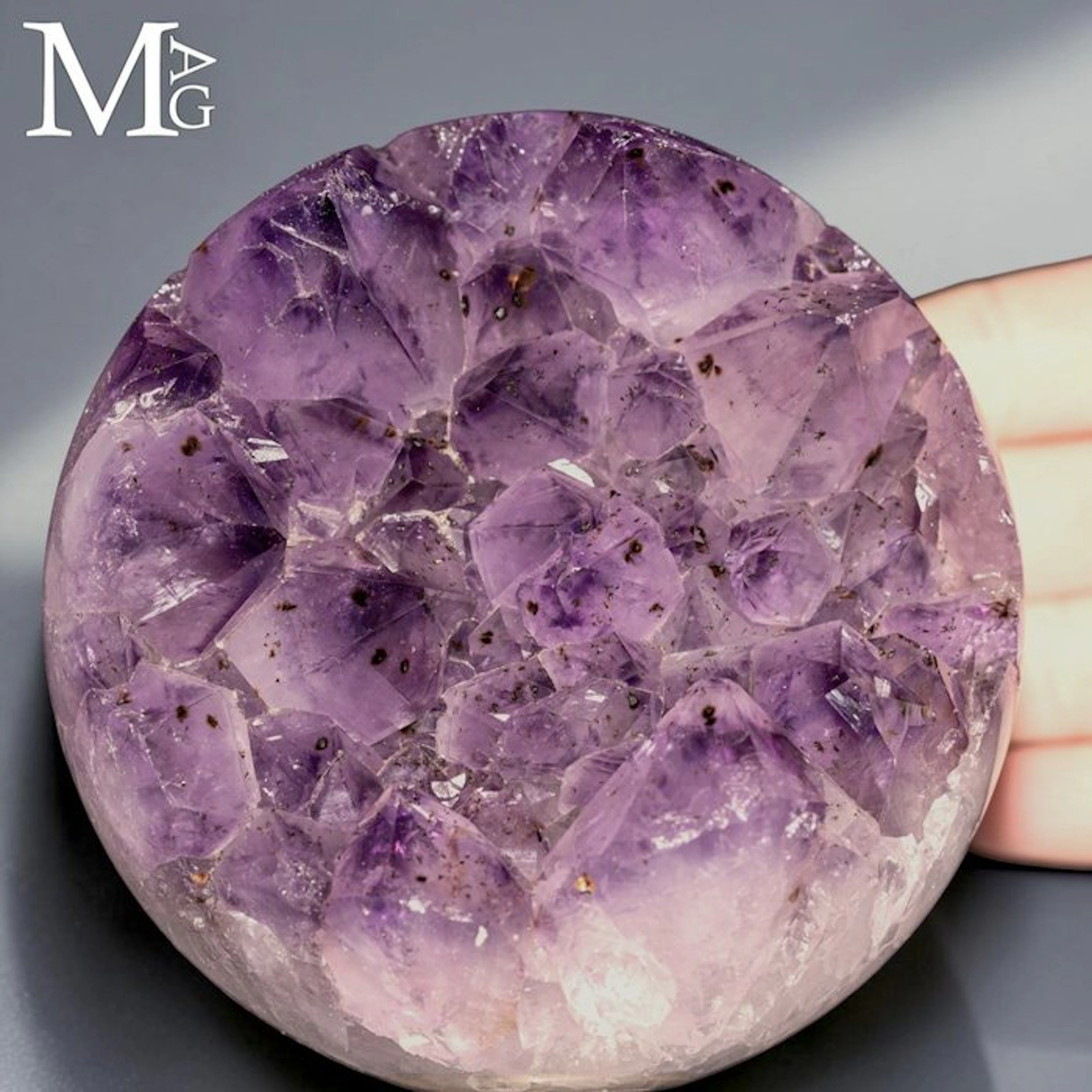 Intense purple amethyst geode sphere