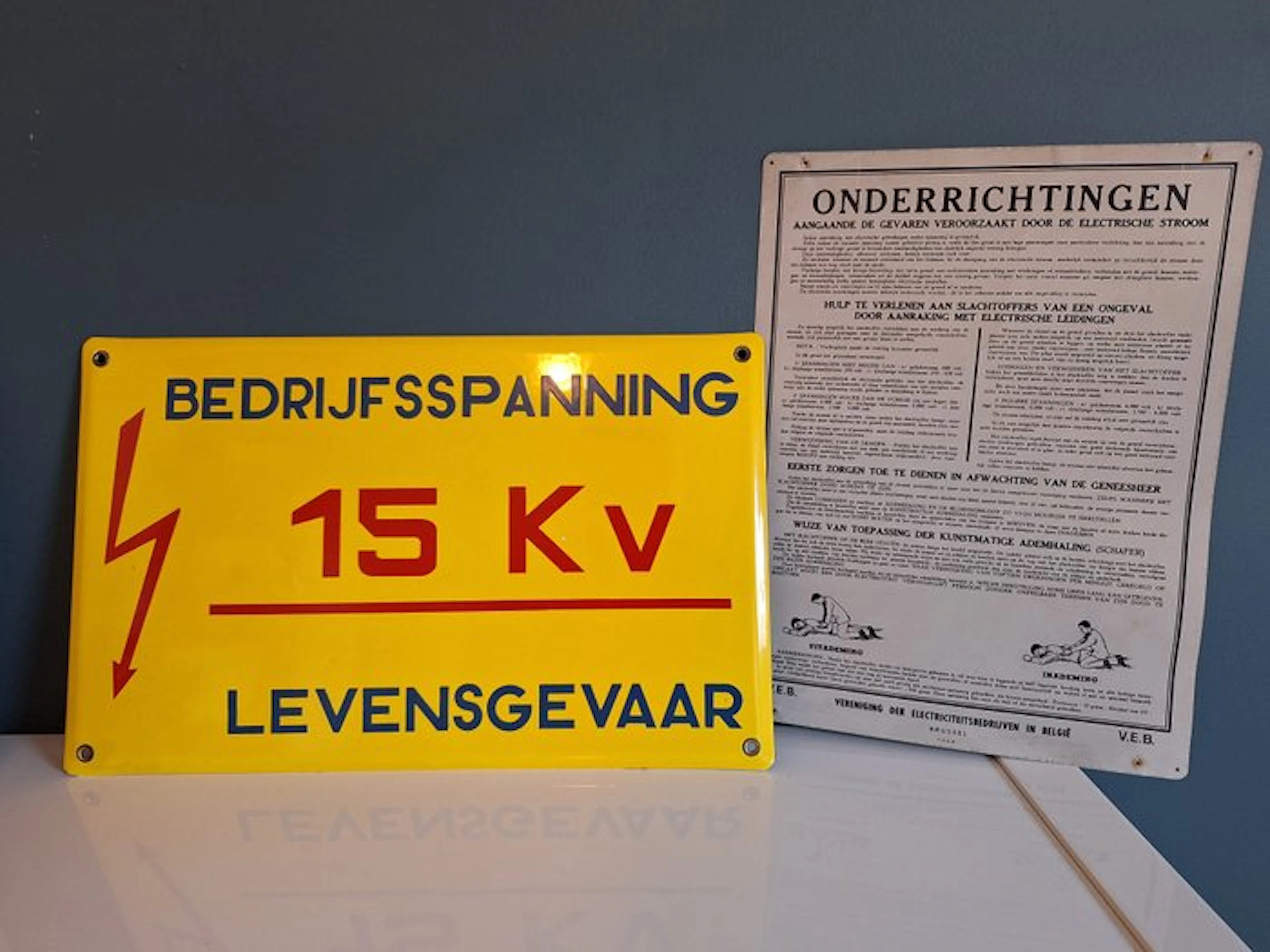 Enamel sign: life-threatening + old first-aid sign...