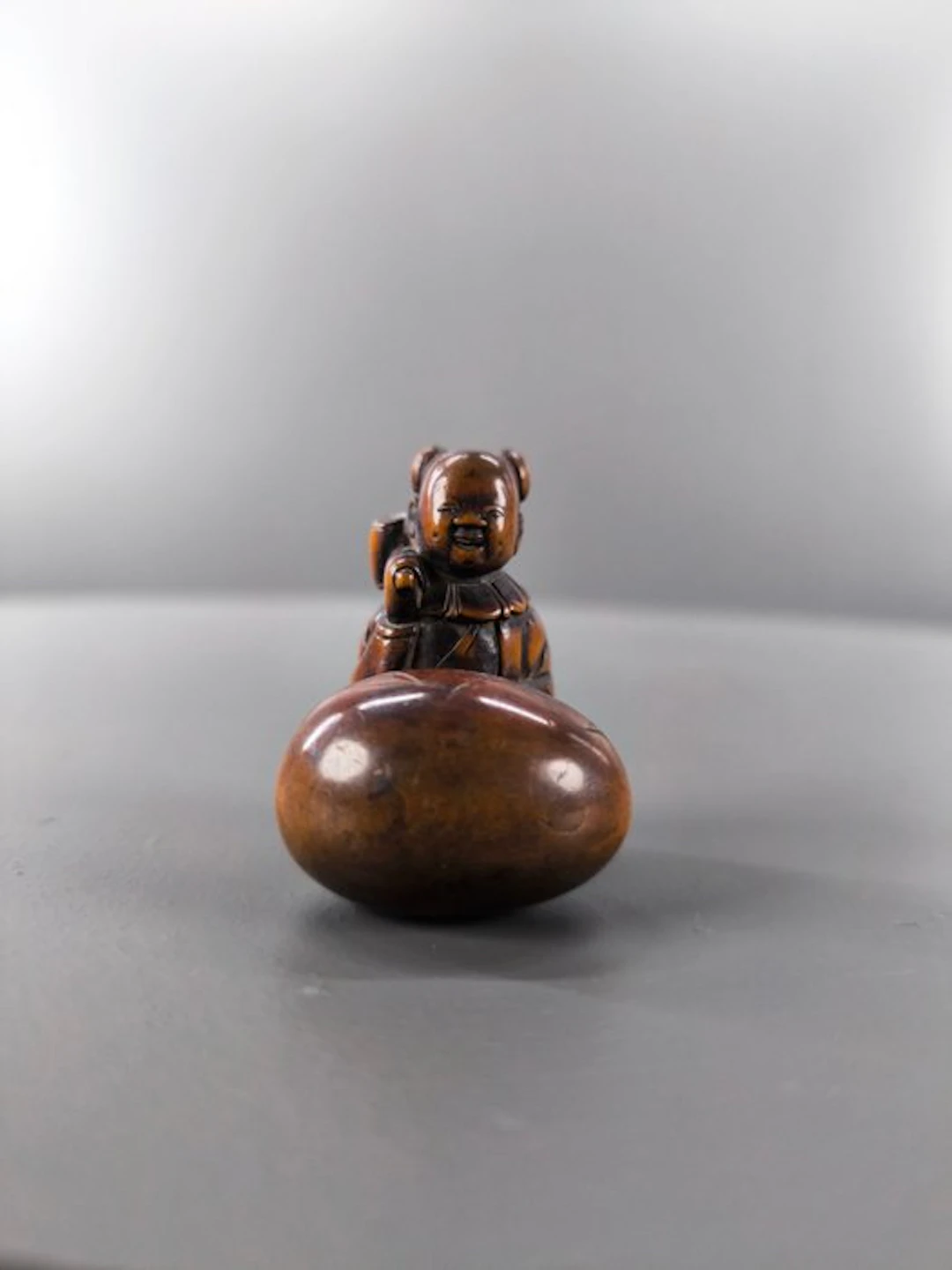 Japan Wood Wooden netsuke depicting a karako with a...