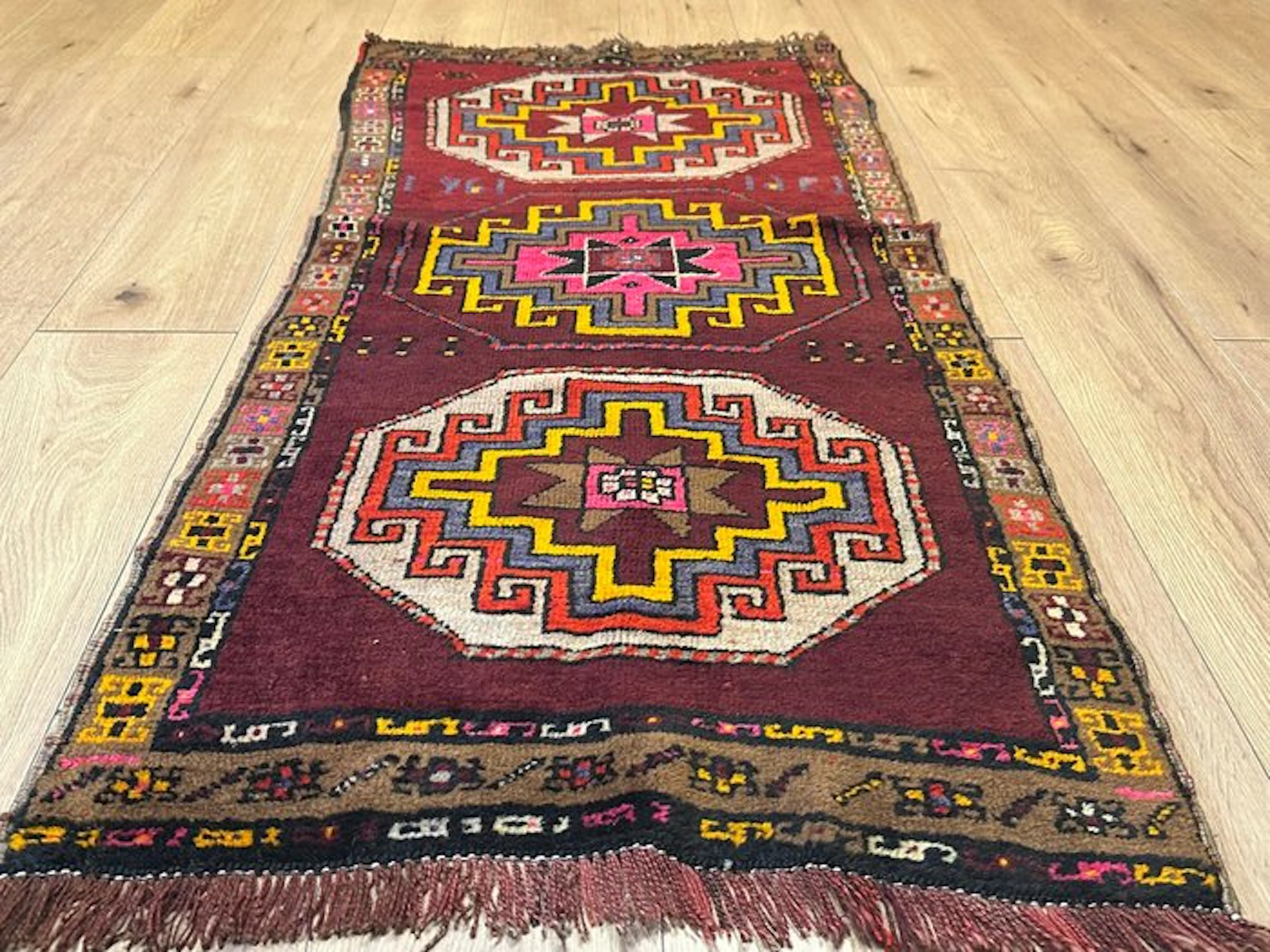 Ancient Anatolian Uşak runner rug with a geometric medallion pattern