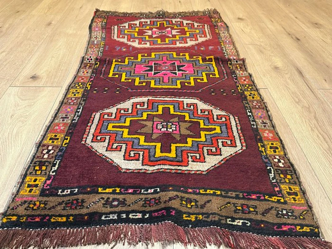 Ancient Anatolian Uşak runner rug with a geometric medallion pattern