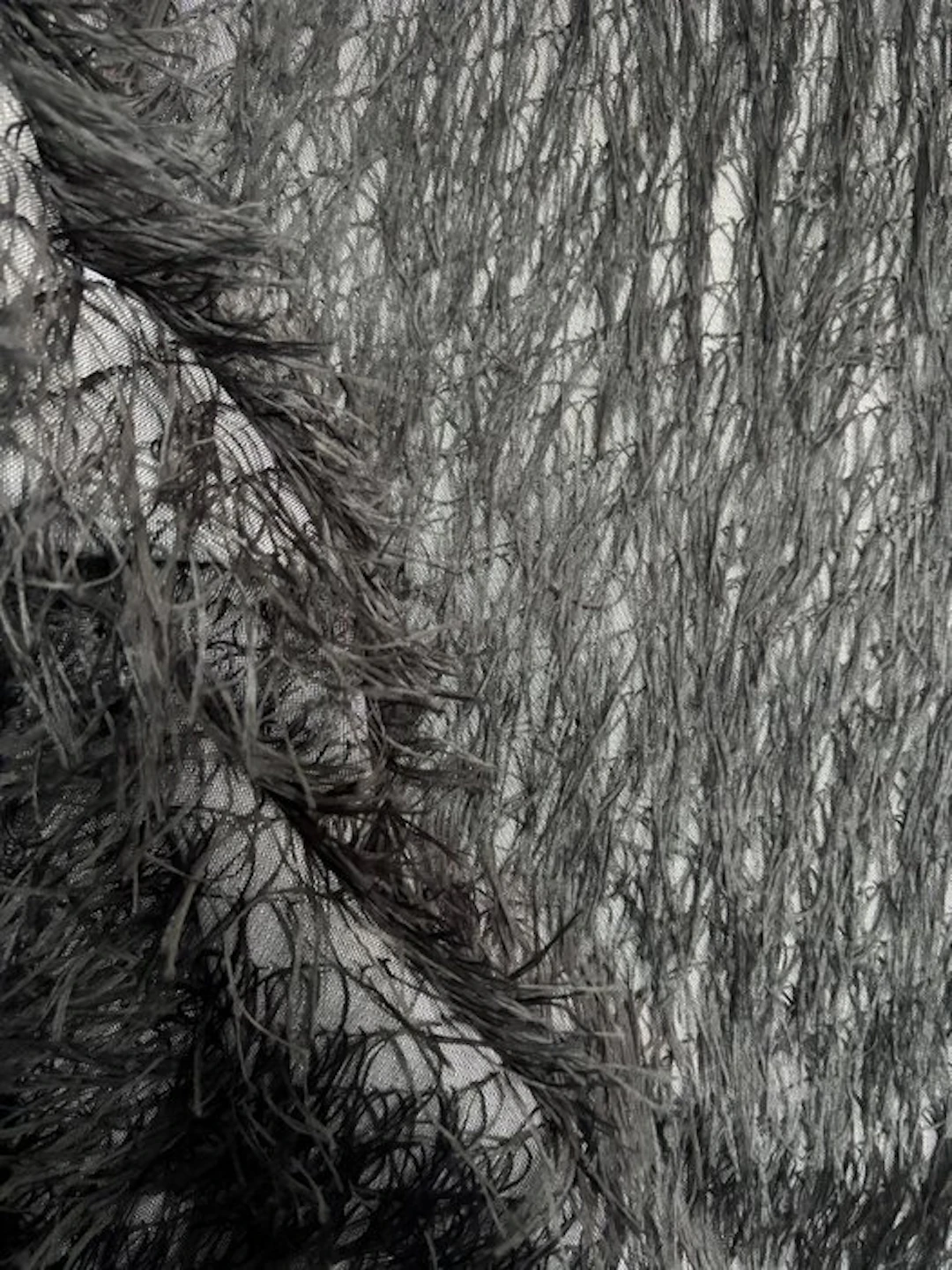 Cut of black faux fur fabric — high fashion