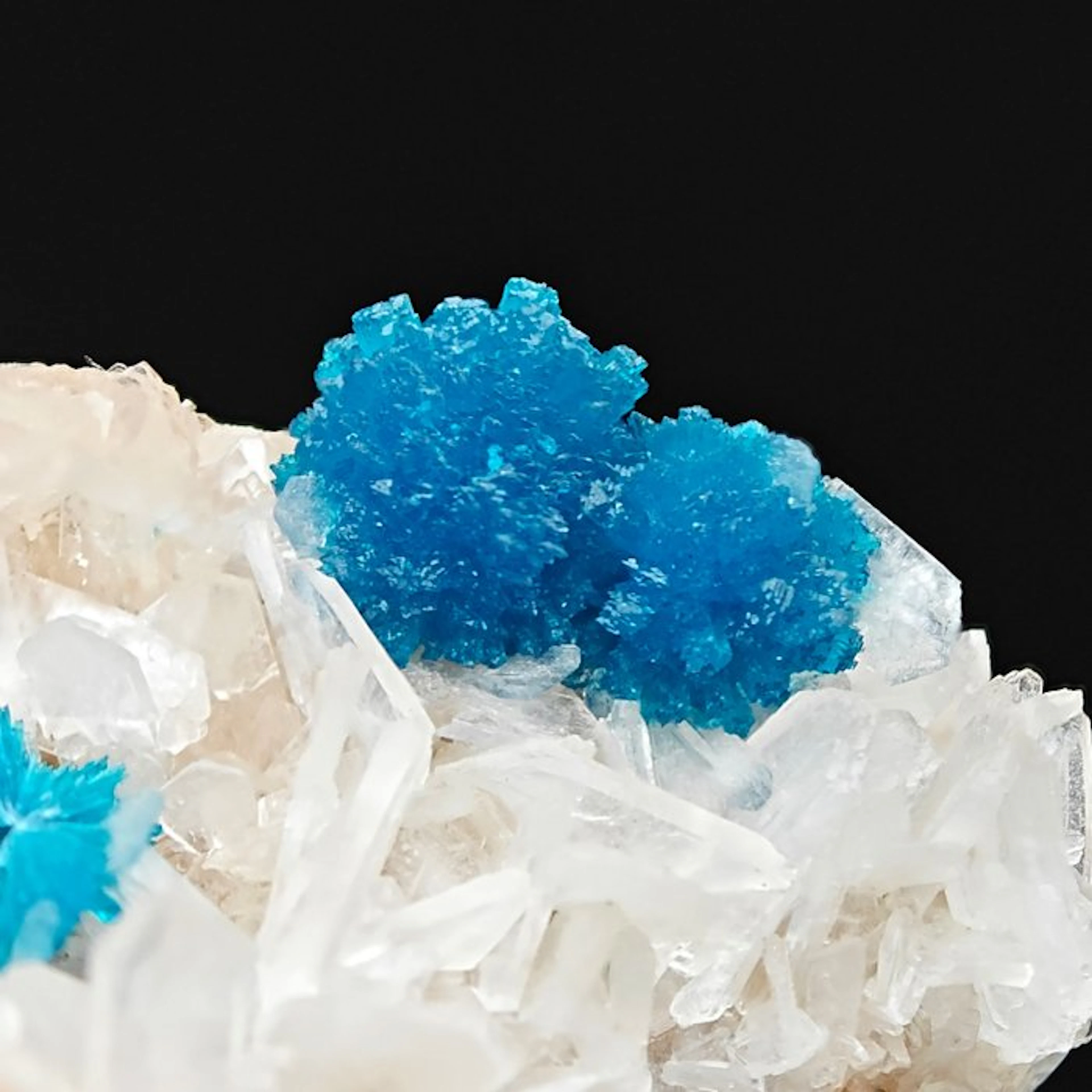 Blue cavansite with pink stilbite tufts