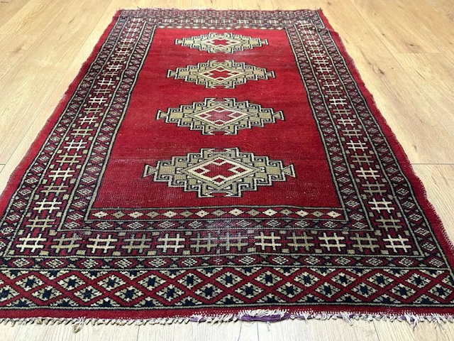 Hand-knotted Bukhara Oriental rug – Geometric diamond medallions & classic red