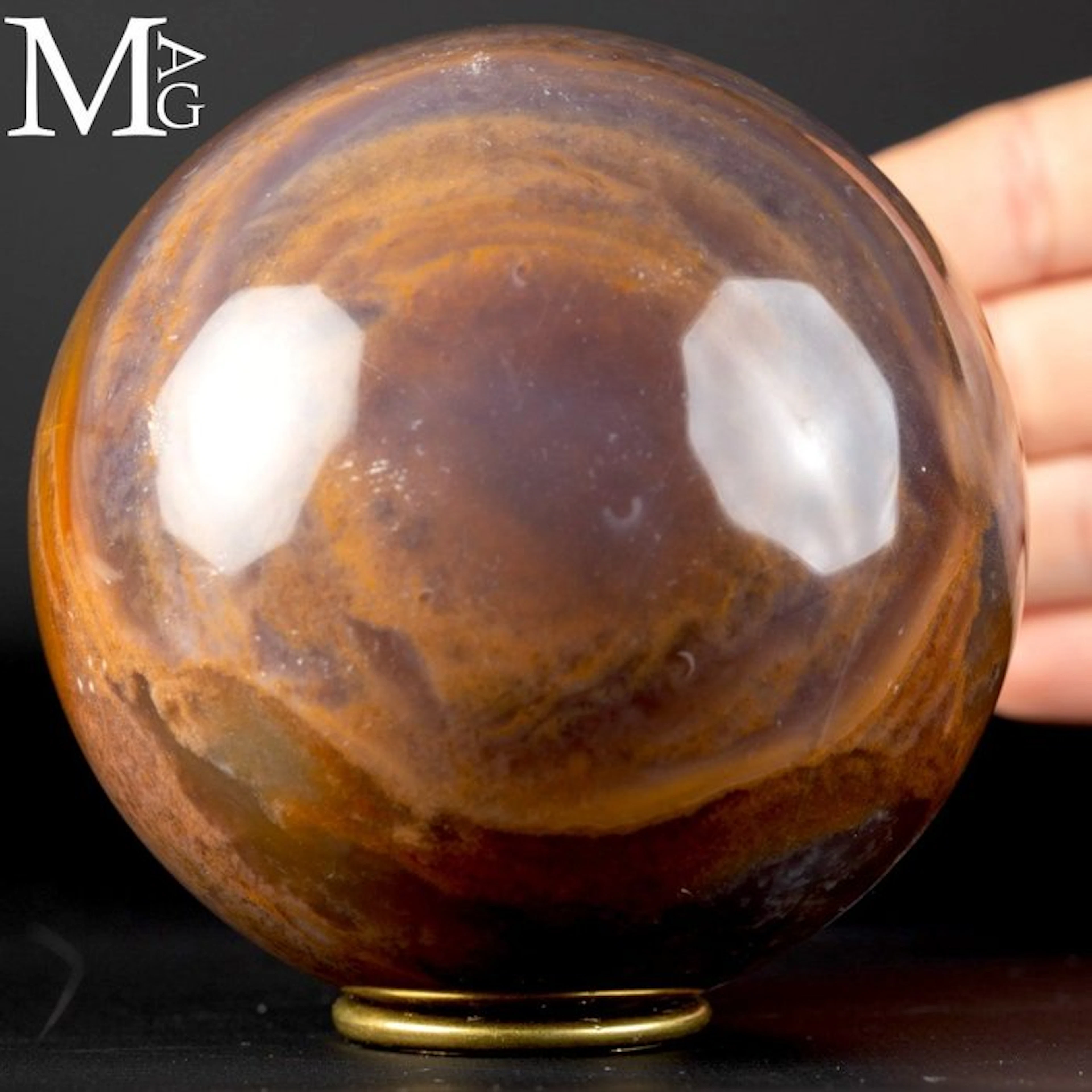 Vibrant Madagascan agate sphere with quartz inclusions...