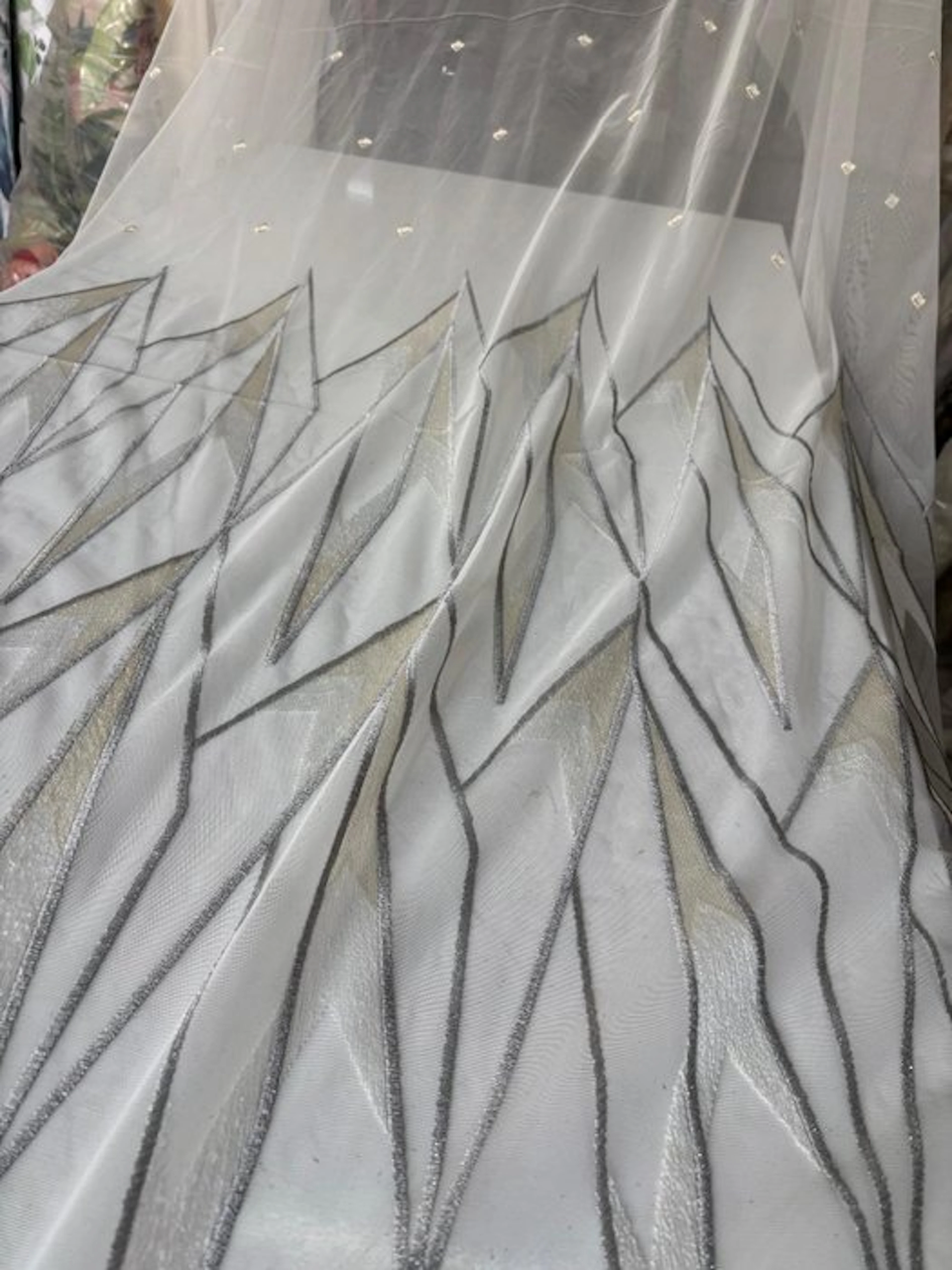 Luxurious curtain fabric: French-embroidered tulle edged at the base