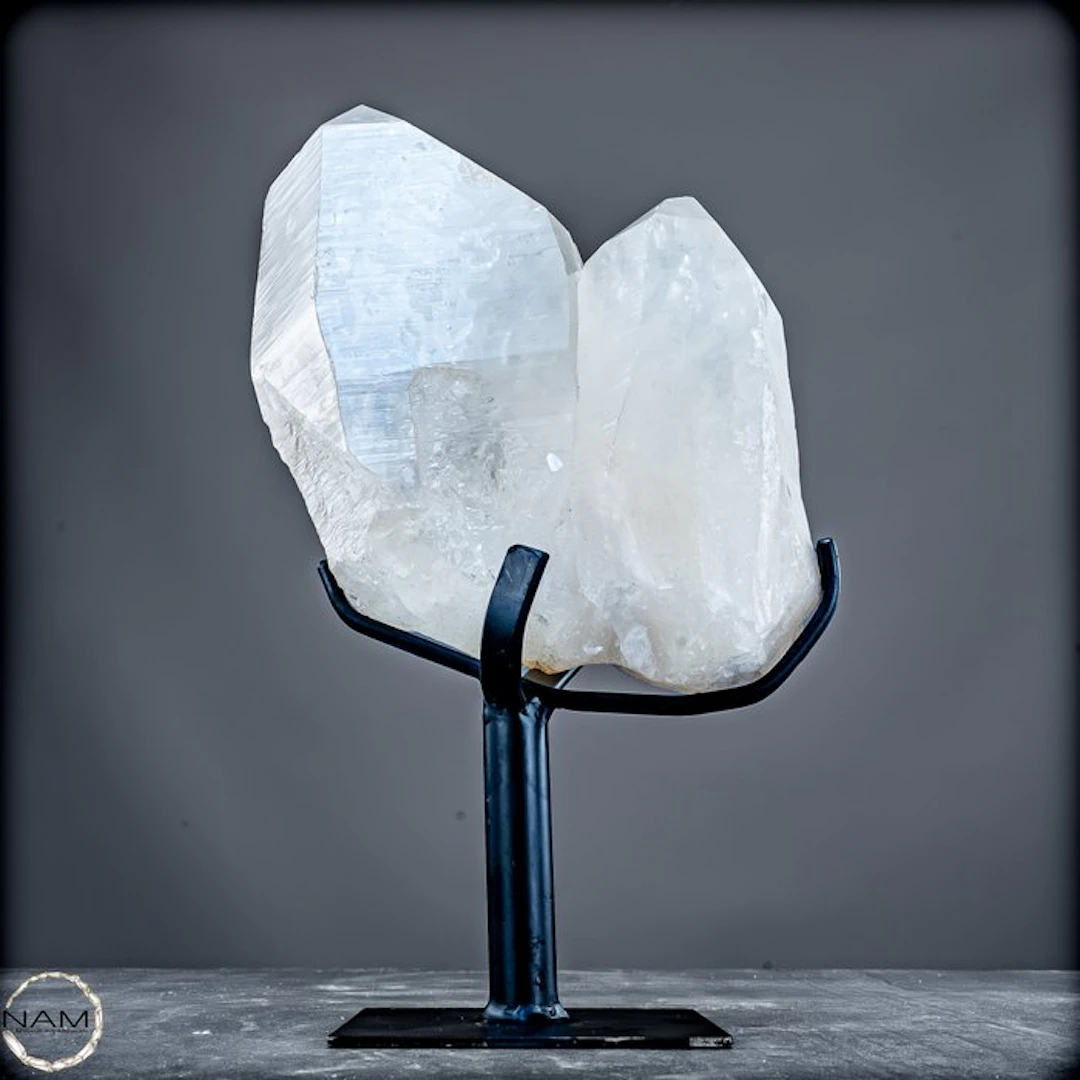 Spectacular 3.9 kg Lemurian quartz crystal on a metal...