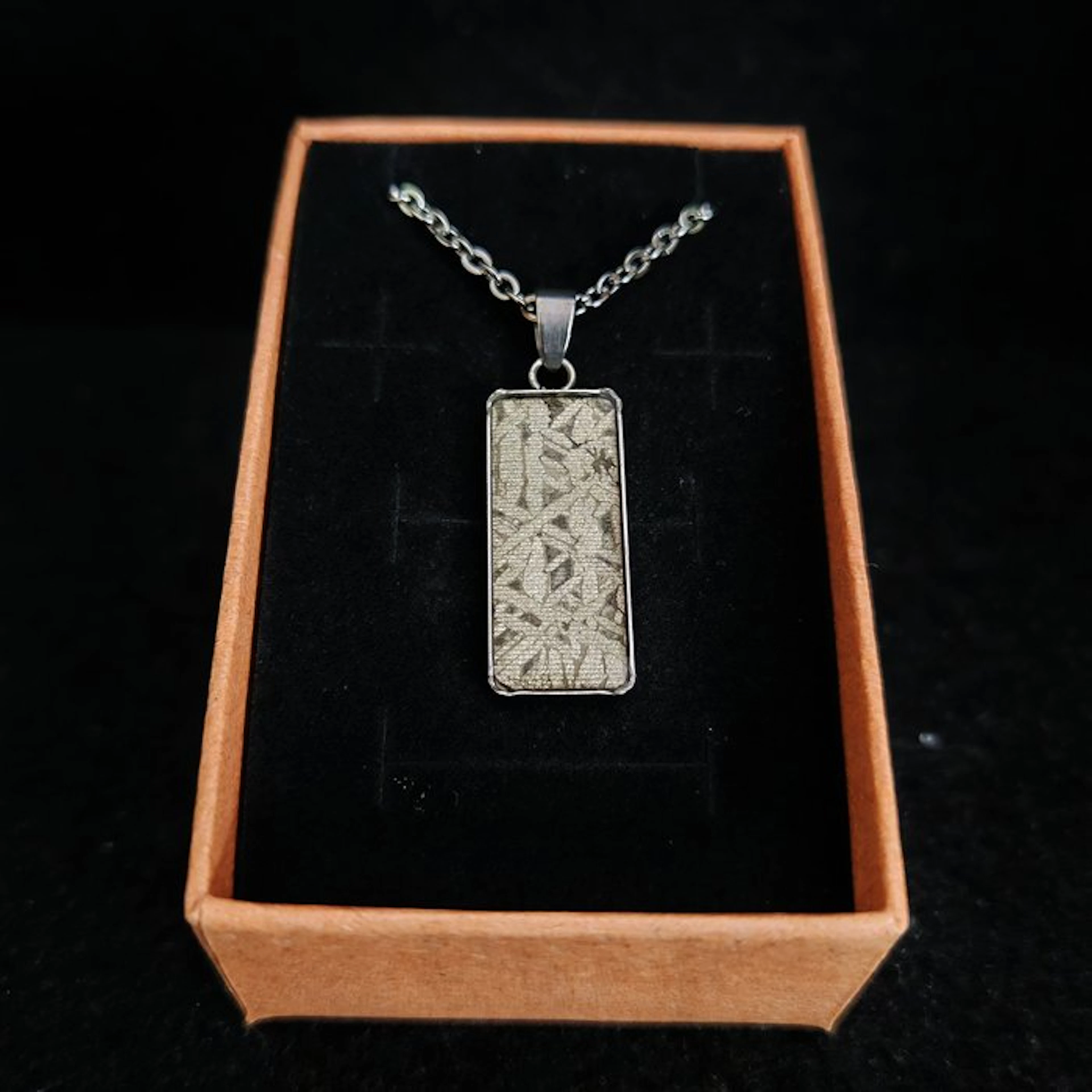 Stainless steel and meteorite pendant with stainless steel chain