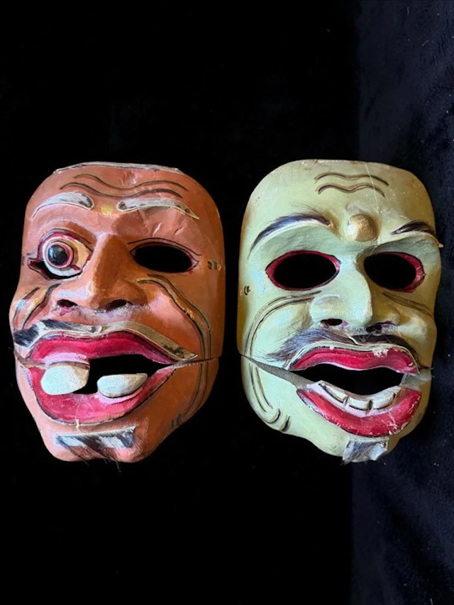 A pair of old Balinese Topeng Bondres theater masks with movable jaws