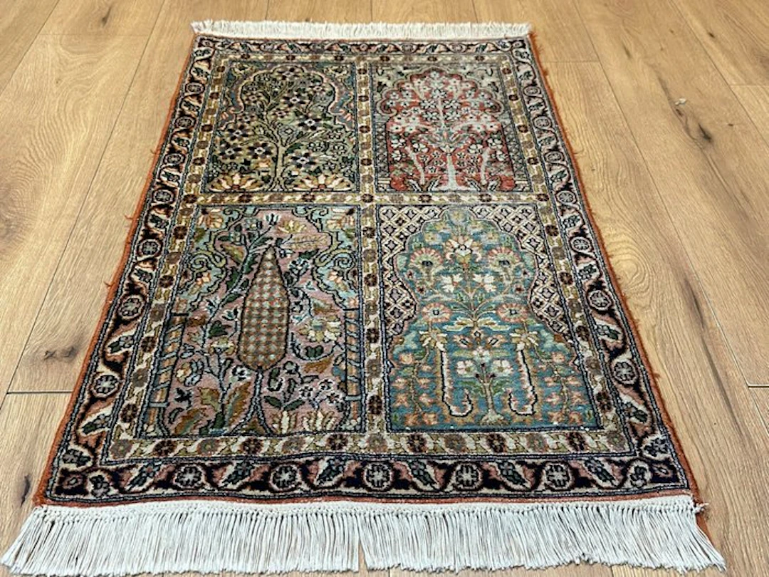 Exquisite Kashmiri silk rug with a delicate four-field...