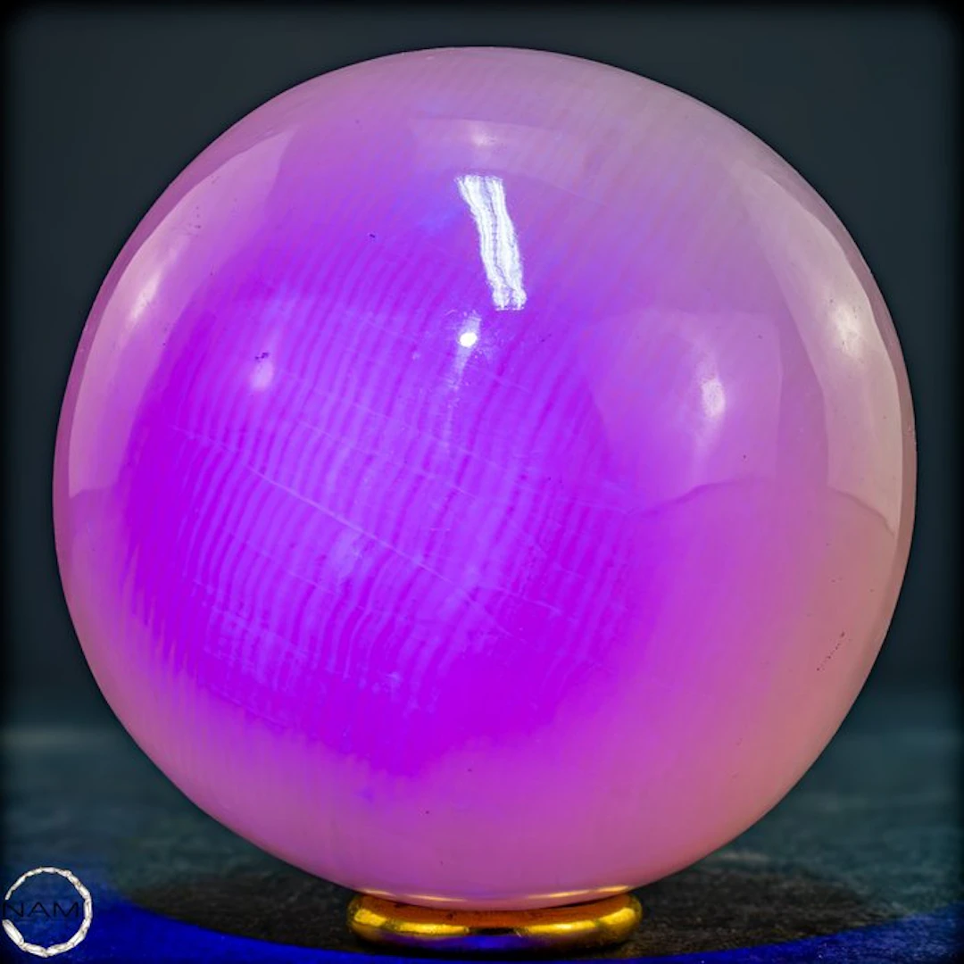 Natural aragonite sphere in soft pink with intense UV fluorescence- 717.54 g