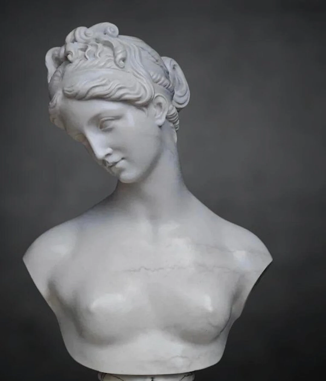 Hand-sculpted marble with a marble finish. Bust - 24 cm