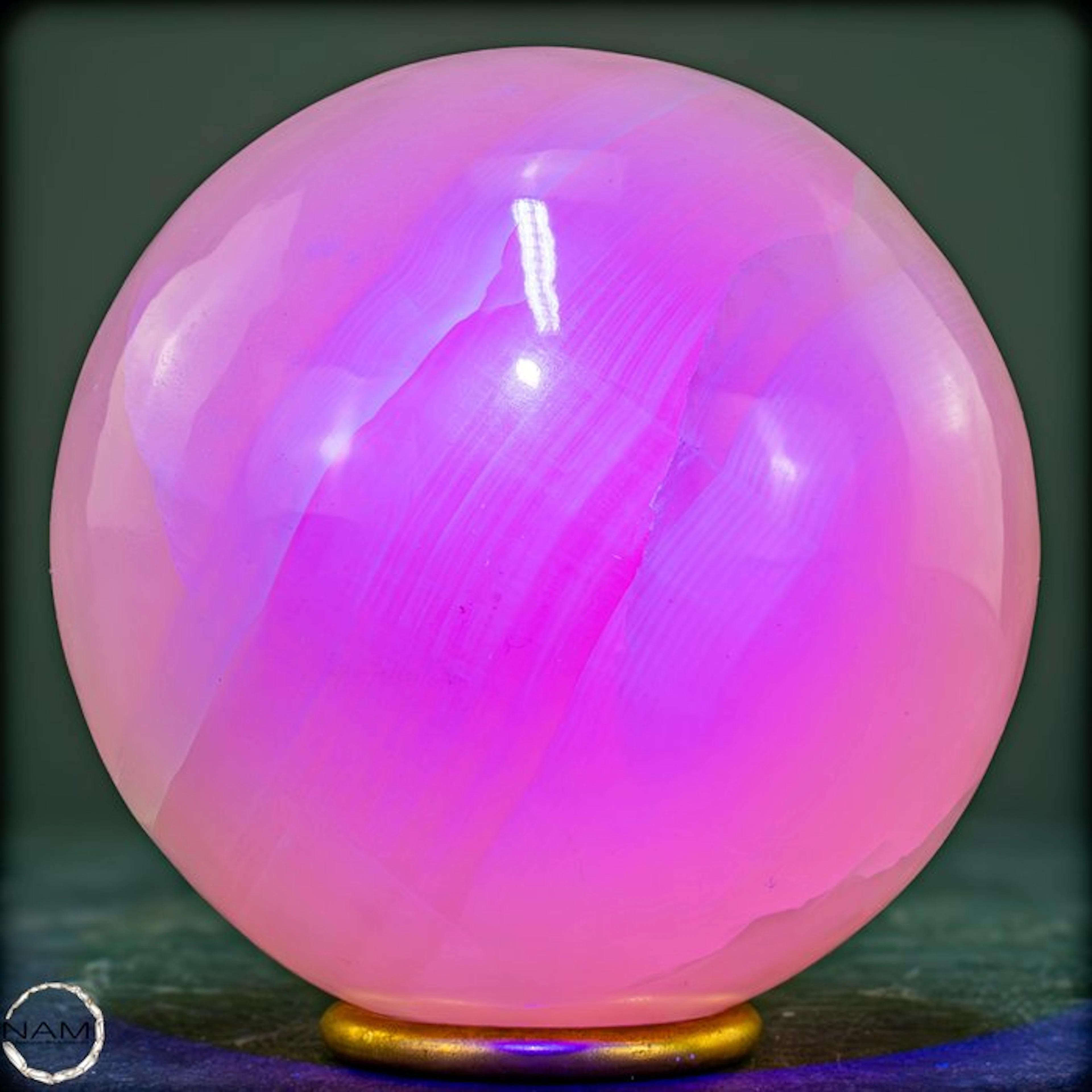 Natural aragonite sphere in soft pink with intense UV fluorescence- 1205.37 g